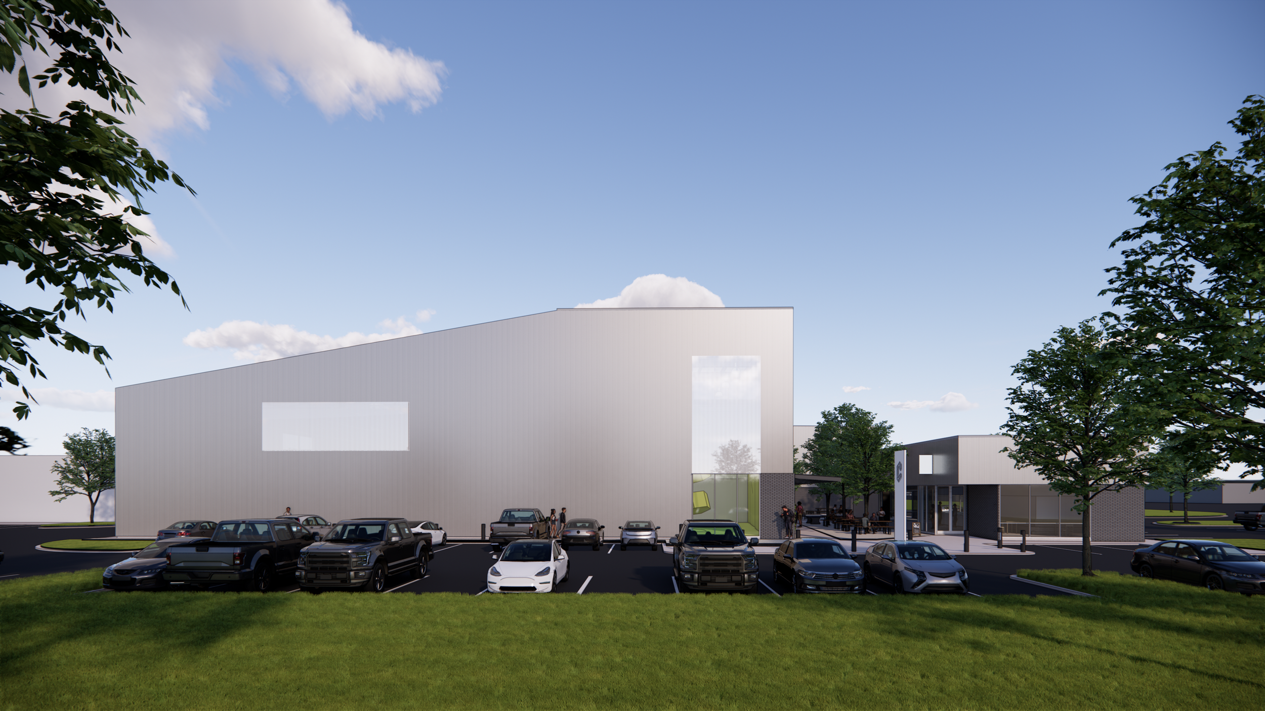 Seen from the parking lot, the Crux façade conceals a complex interior while introducing a sculptural presence to the suburban context. Strategic openings offer glimpses of activity within.