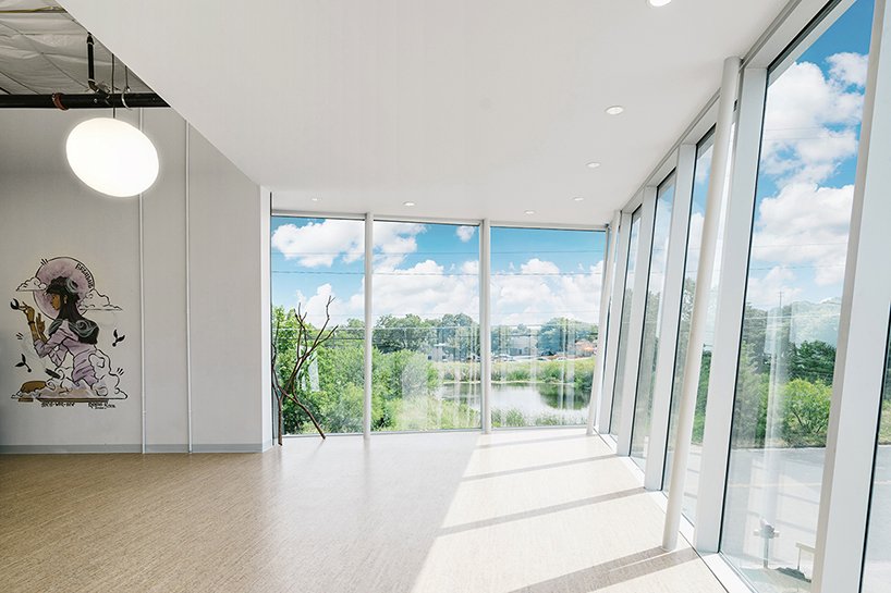 The cantilevered tilted glazing of the yoga studio looking north toward downtown.