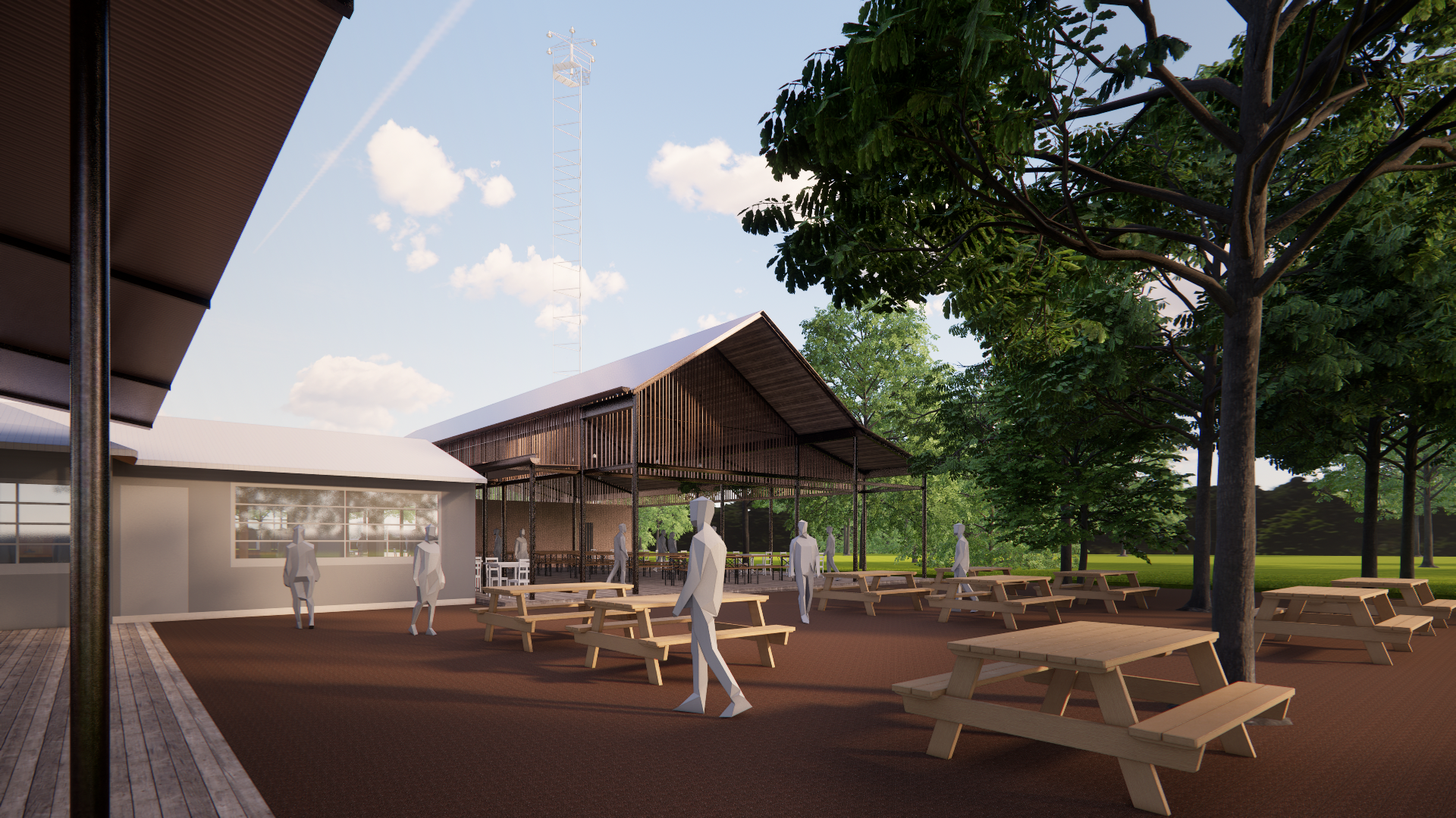 A shaded courtyard anchors the outdoor experience with picnic seating under mature trees. The new dance hall structure opens onto this shared space, creating a fluid relationship between interior and landscape.