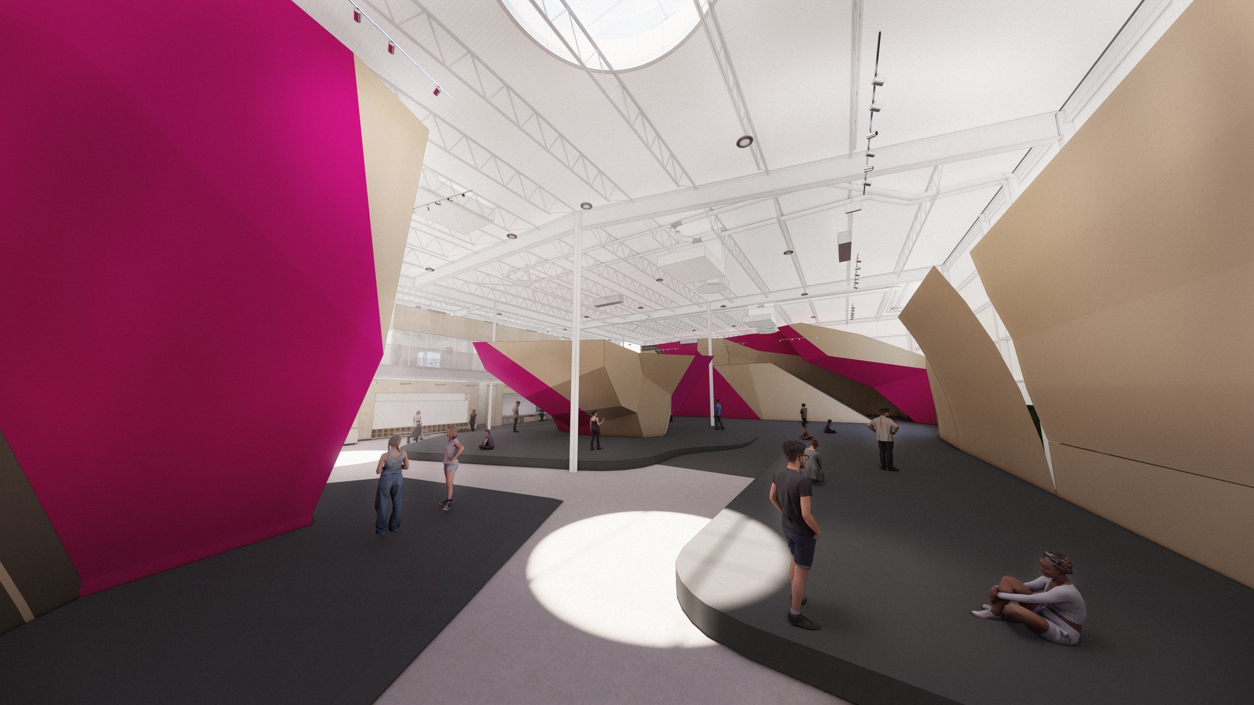 A large circular skylight marks the center of the bouldering hall—bringing daylight deep into the space and creating a dramatic focal point overhead.
