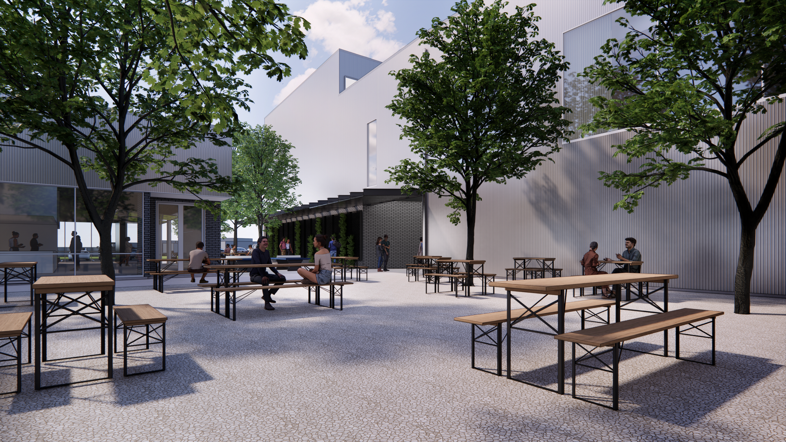 Positioned between the coffee shop, food truck pad, and climbing gym entry, this courtyard serves as a shared outdoor room for all users. Inviting yet protected, it draws people into a communal space that connects the different programs of the site.