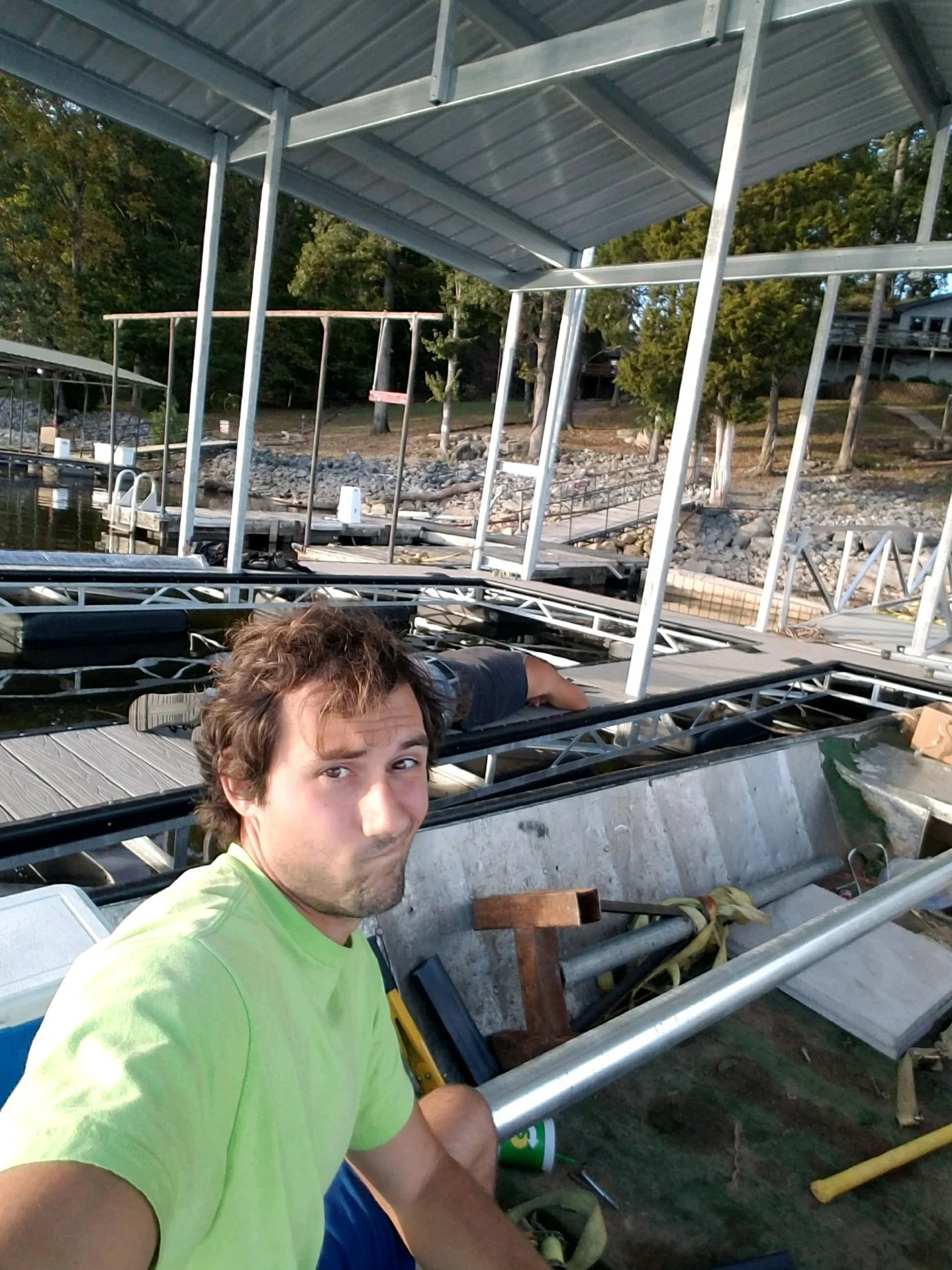 Young Drew Williams building boat dock