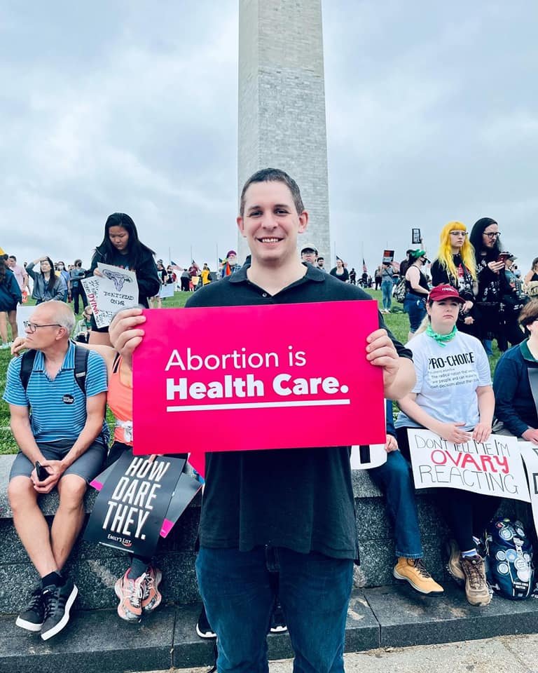 Eli at a reproductive rights protest in front of the Washington Monument.