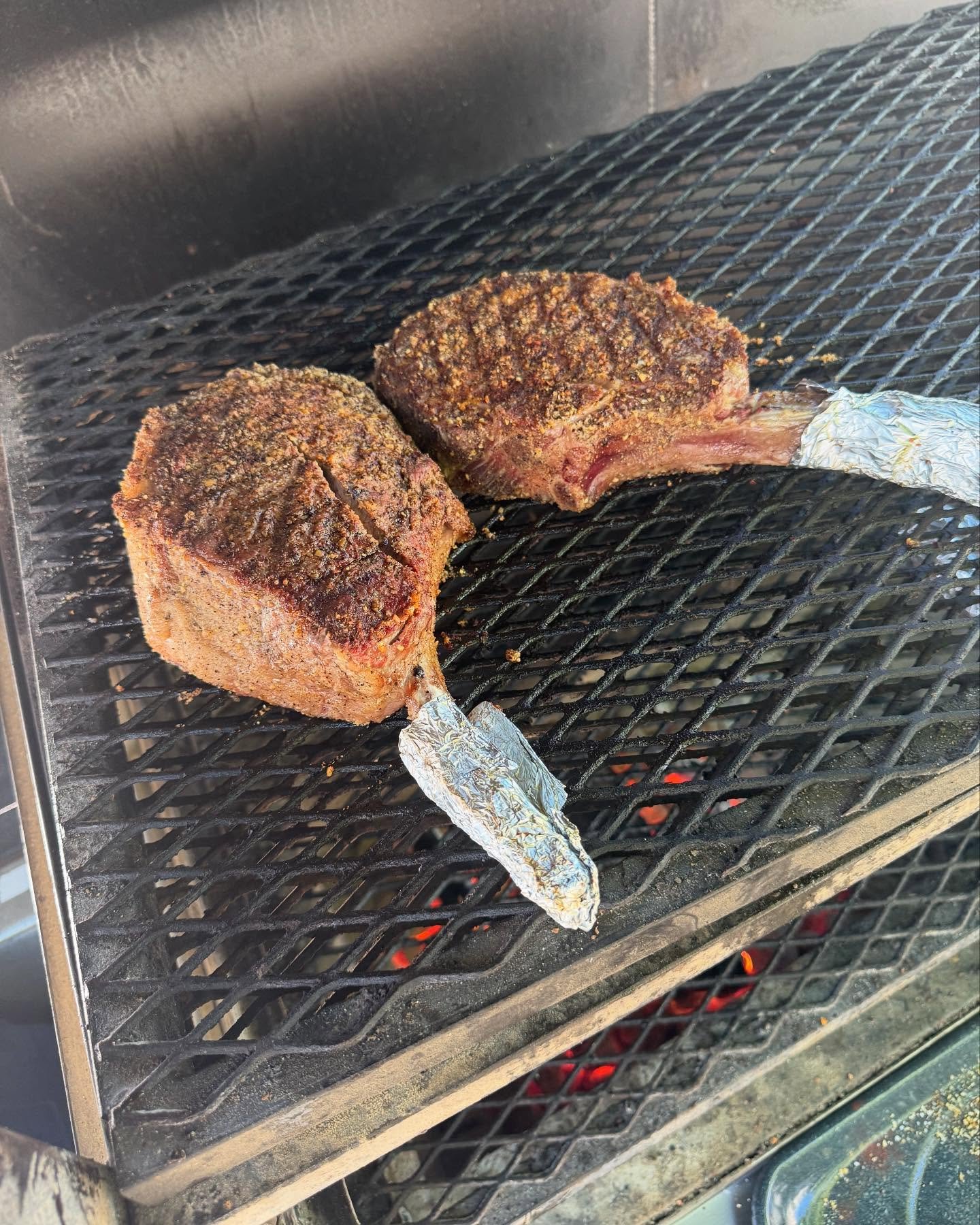 Private chef usda prime tomahawk steaks cooked over open fire w/ oak and almond woods