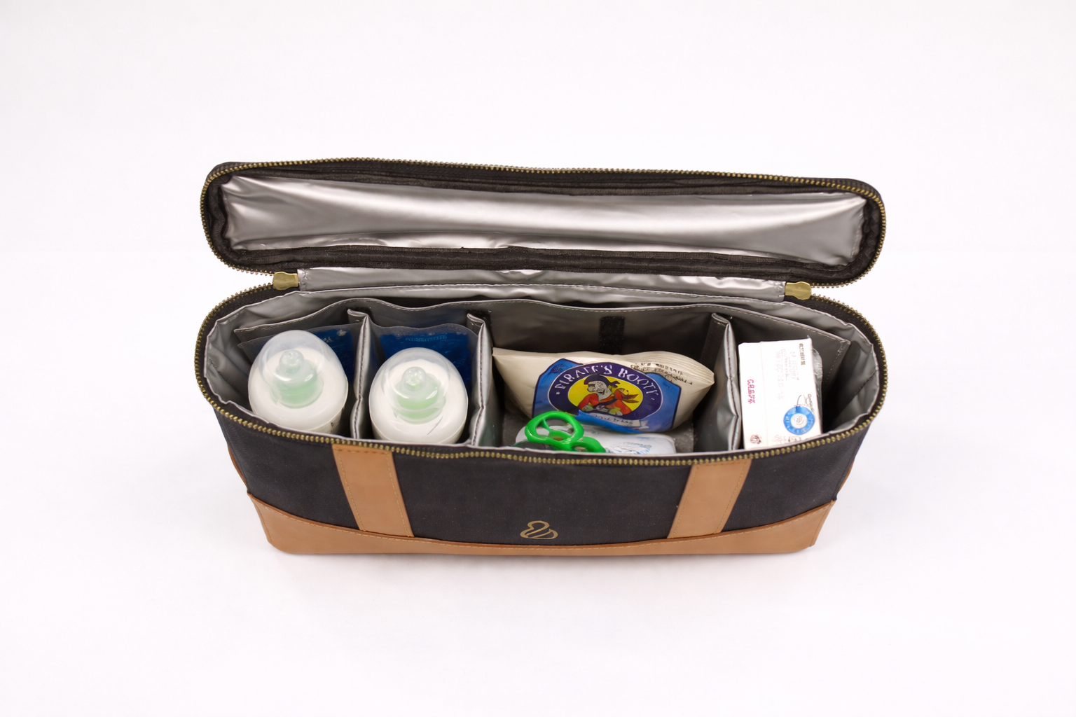Interior of The Little Hauler Insulated Pod, part of the modular pod with various snack and beverage items, showcasing it's use as an insulated snack and lunch box.