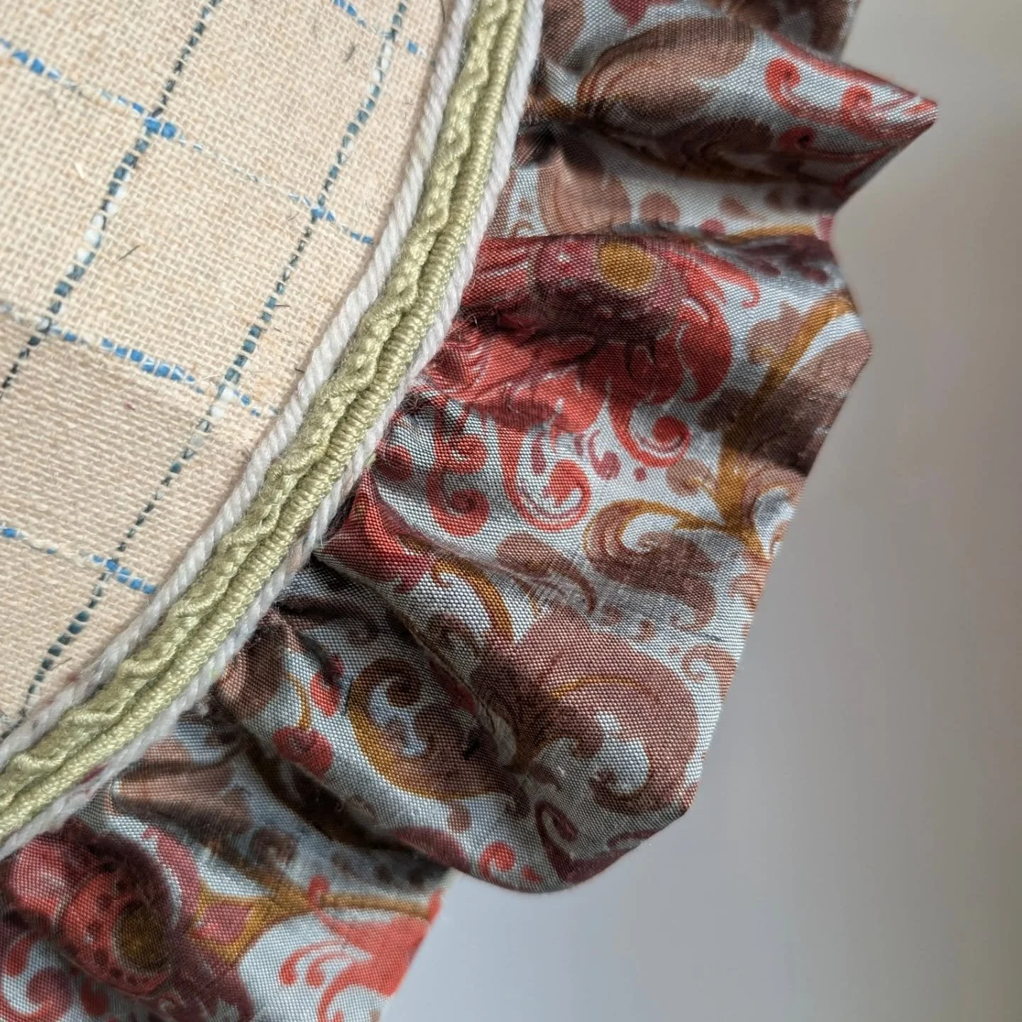 I love combining interesting texture and pattern, and this shade does it all 🪡💡

The linear, flat pattern of the outer layer clashes perfectly with an abundance of ruffles made from rich floral silk. Tied together with alternating strips of vintage