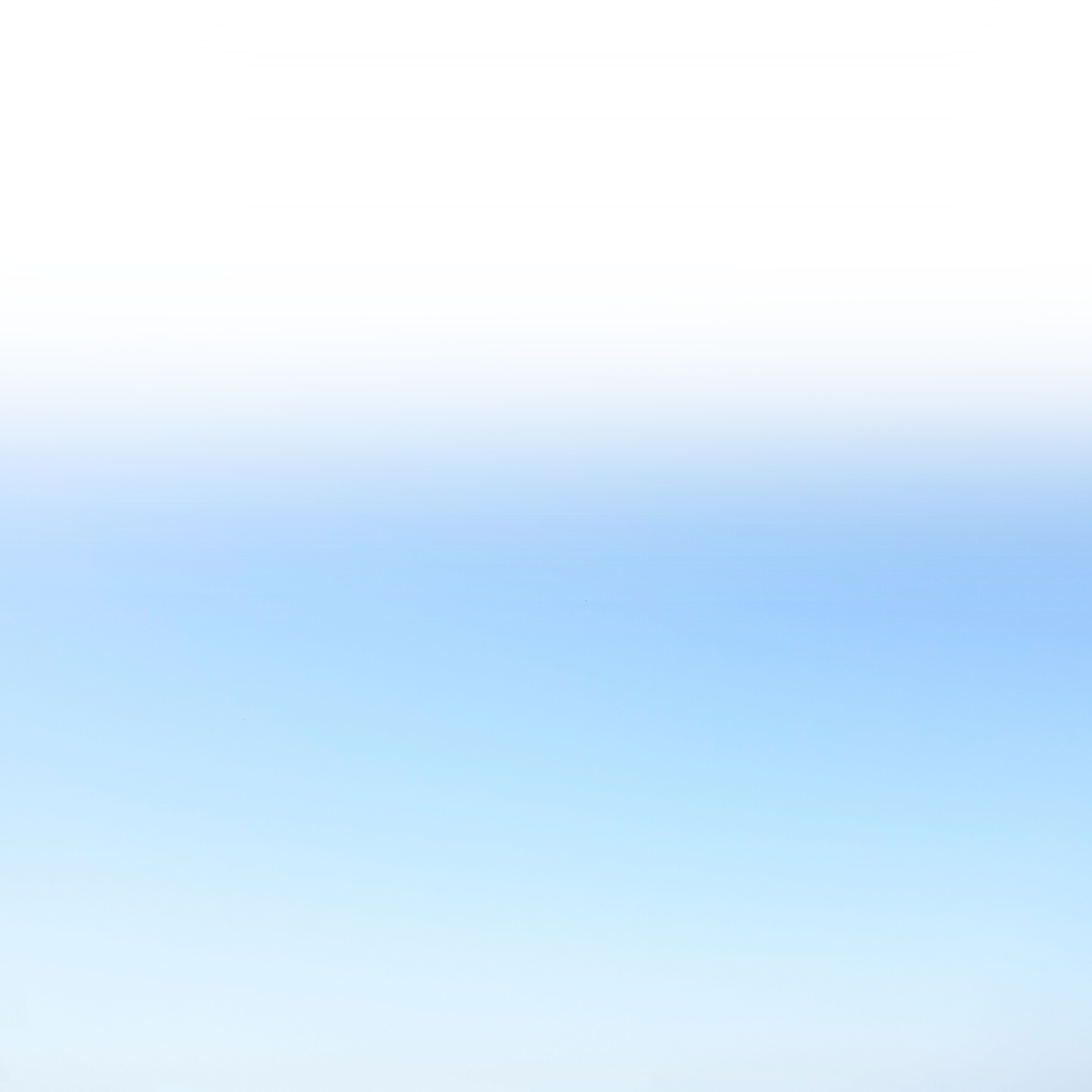 A gradient background transitioning from white at the top to light blue at the bottom.