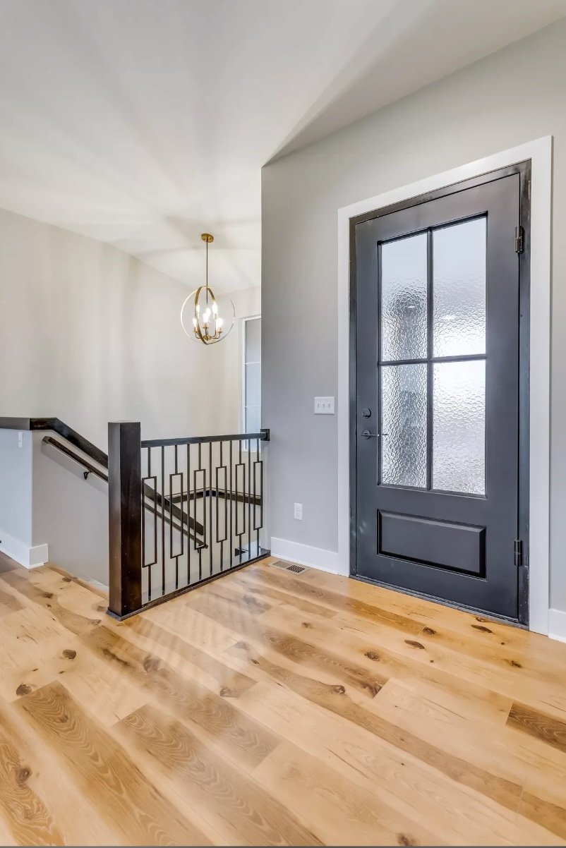 classic-iron-pivot-door-luxury-homes.jpeg