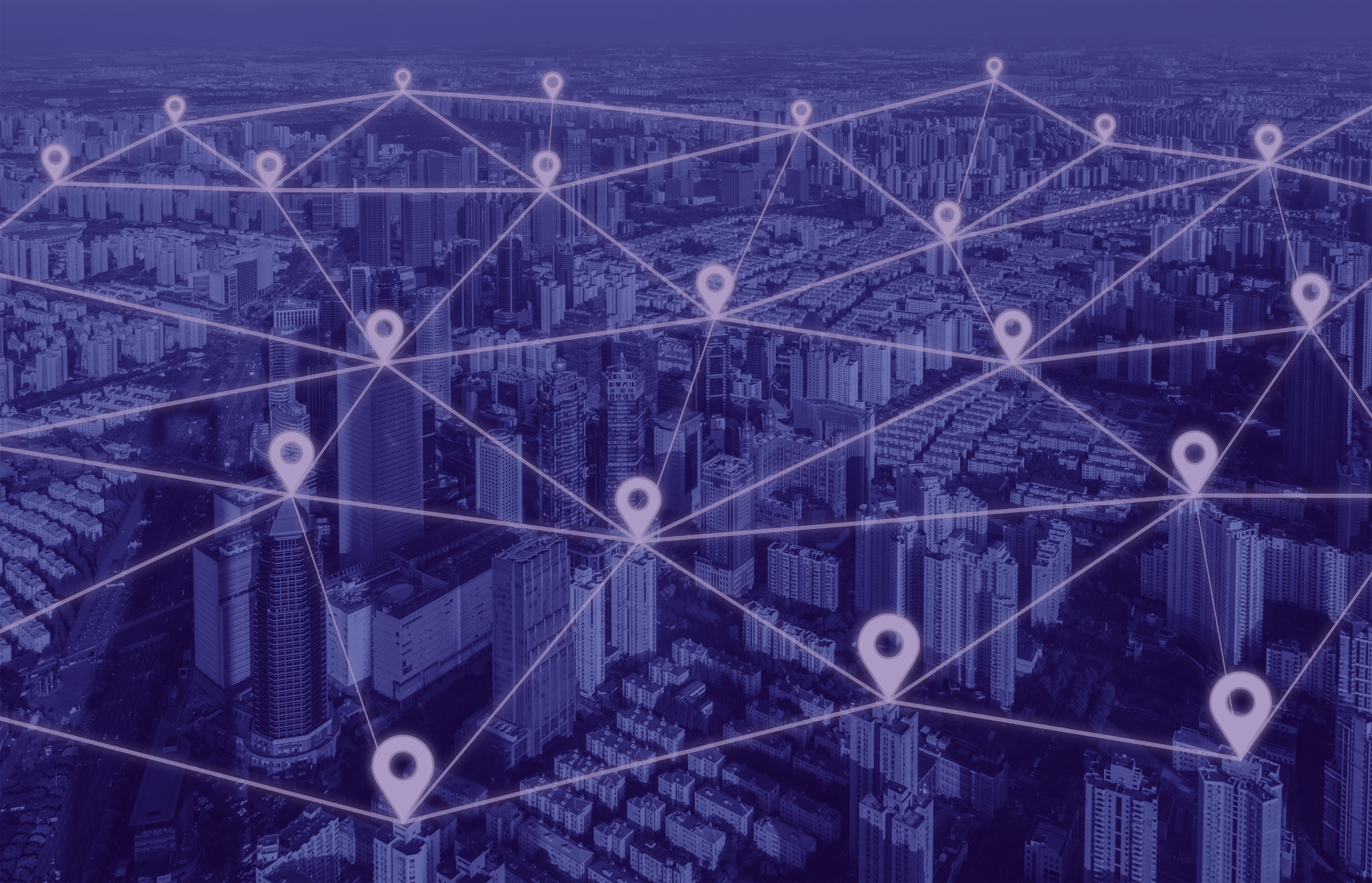 A city view from above with pins connected throughout to display a vast network.