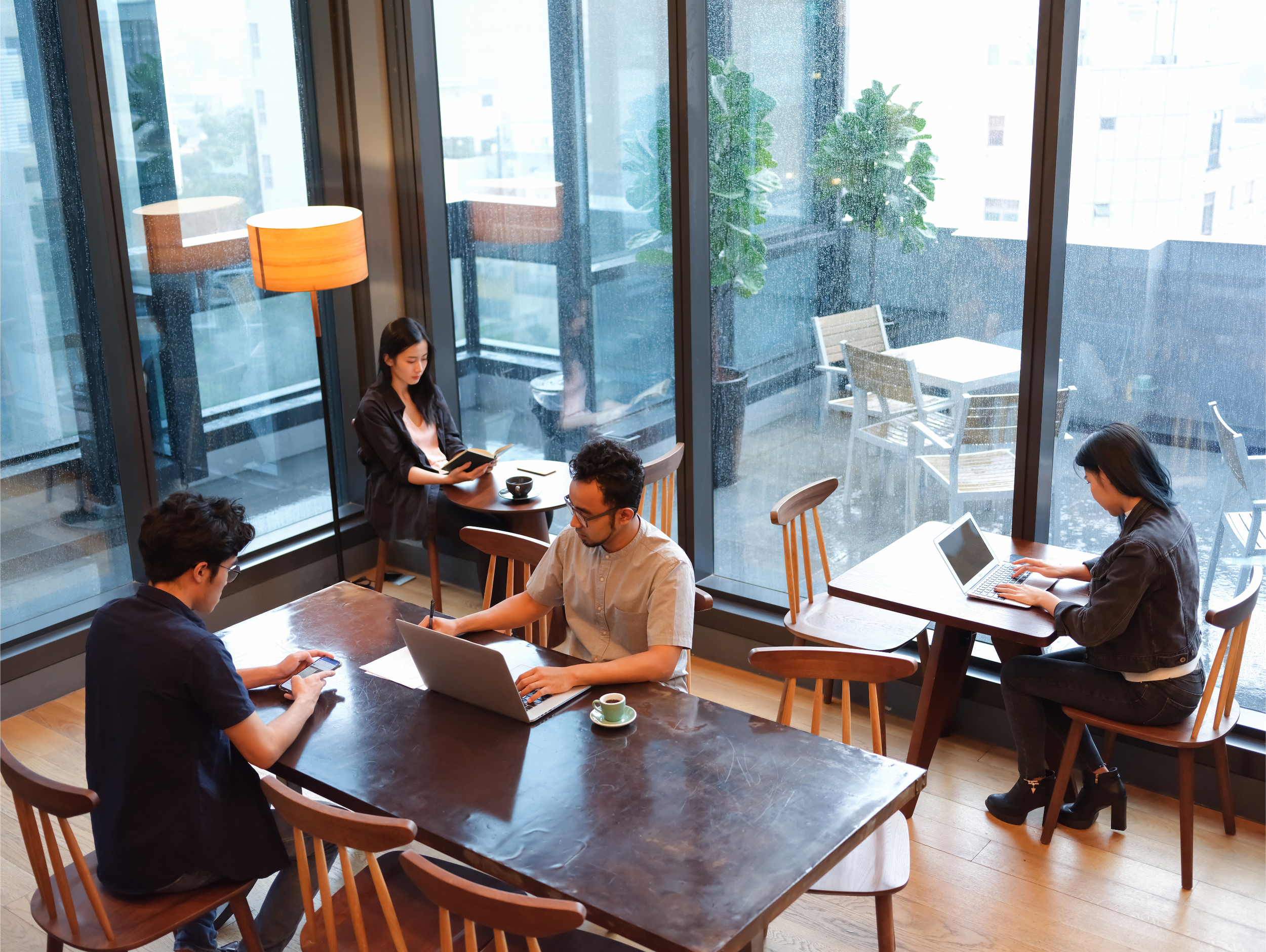 Residents working at their building's coworking space.
