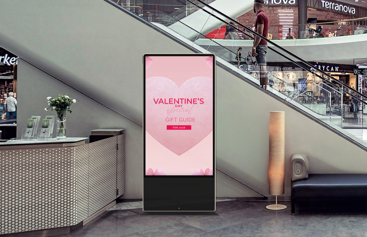 A large display kiosk in a retail mall, displaying local advertisement.