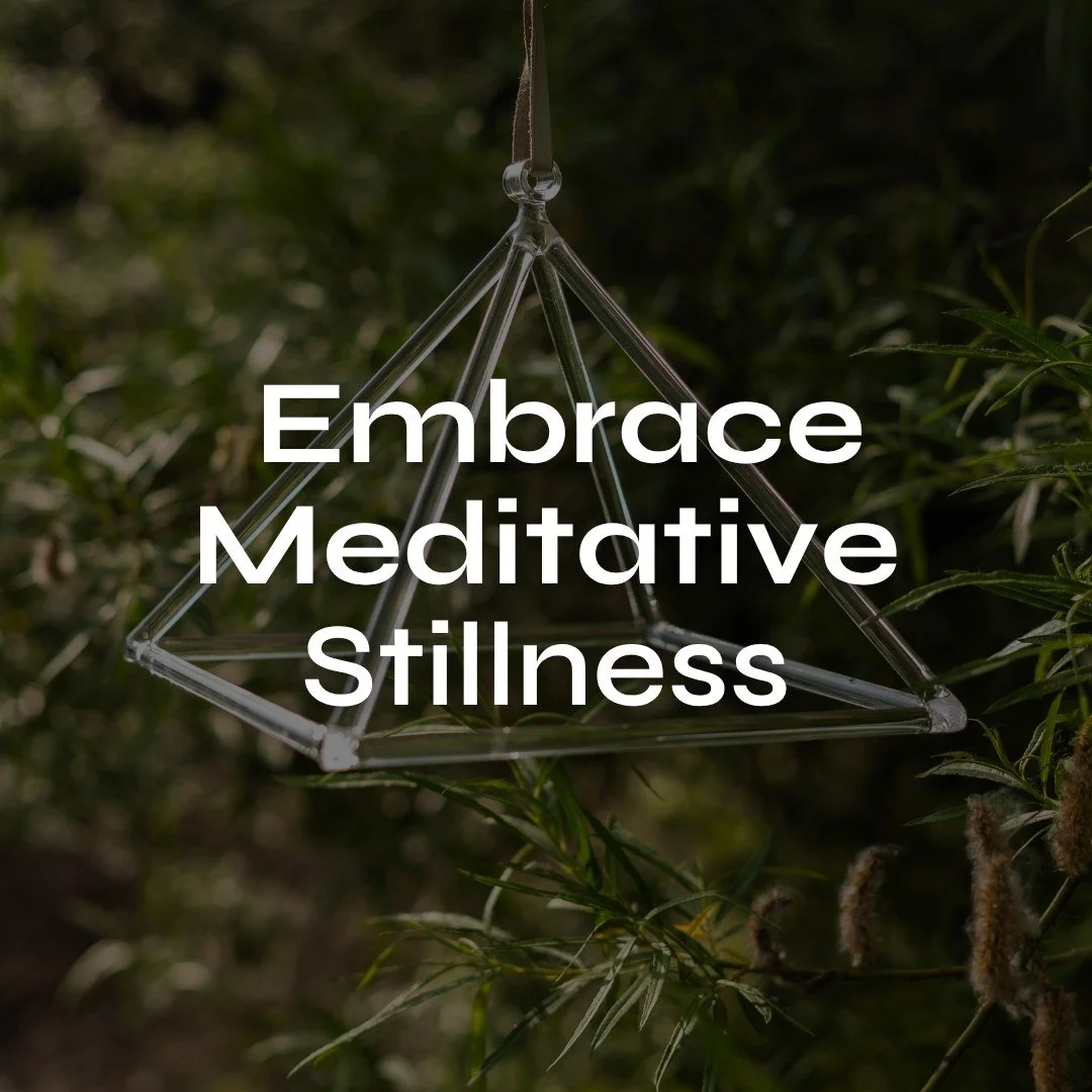 A geometric singing pyramid hanging outdoors with the text 'Embrace Meditative Stillness' overlaid, set against a background of green foliage.