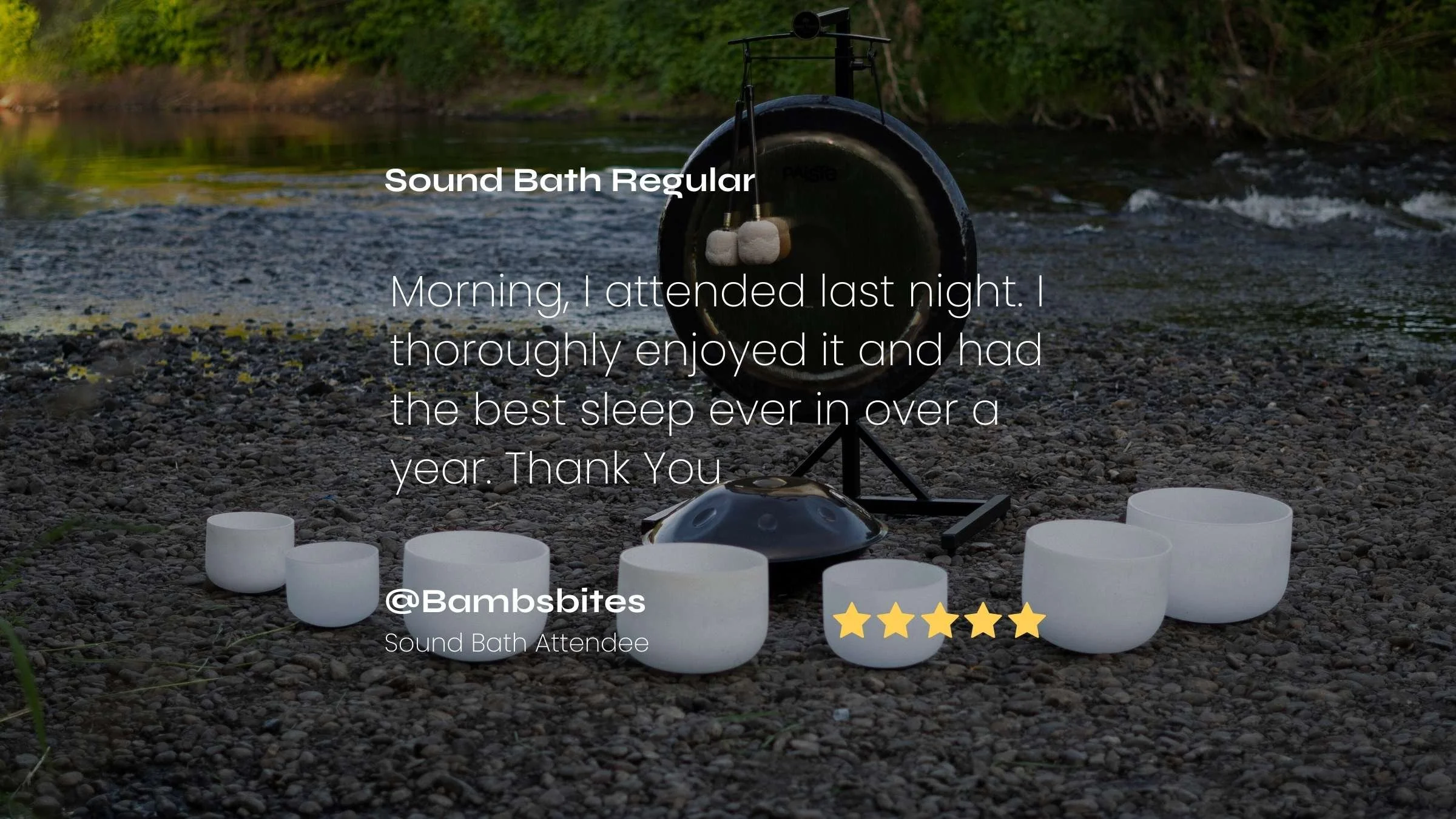 A set of white crystal singing bowls and a paiste gong with a mallet on a serene riverbank, with a calm river in the background. Overlaid text includes a five star review message, recommending the sound bath experience and a five-star rating.