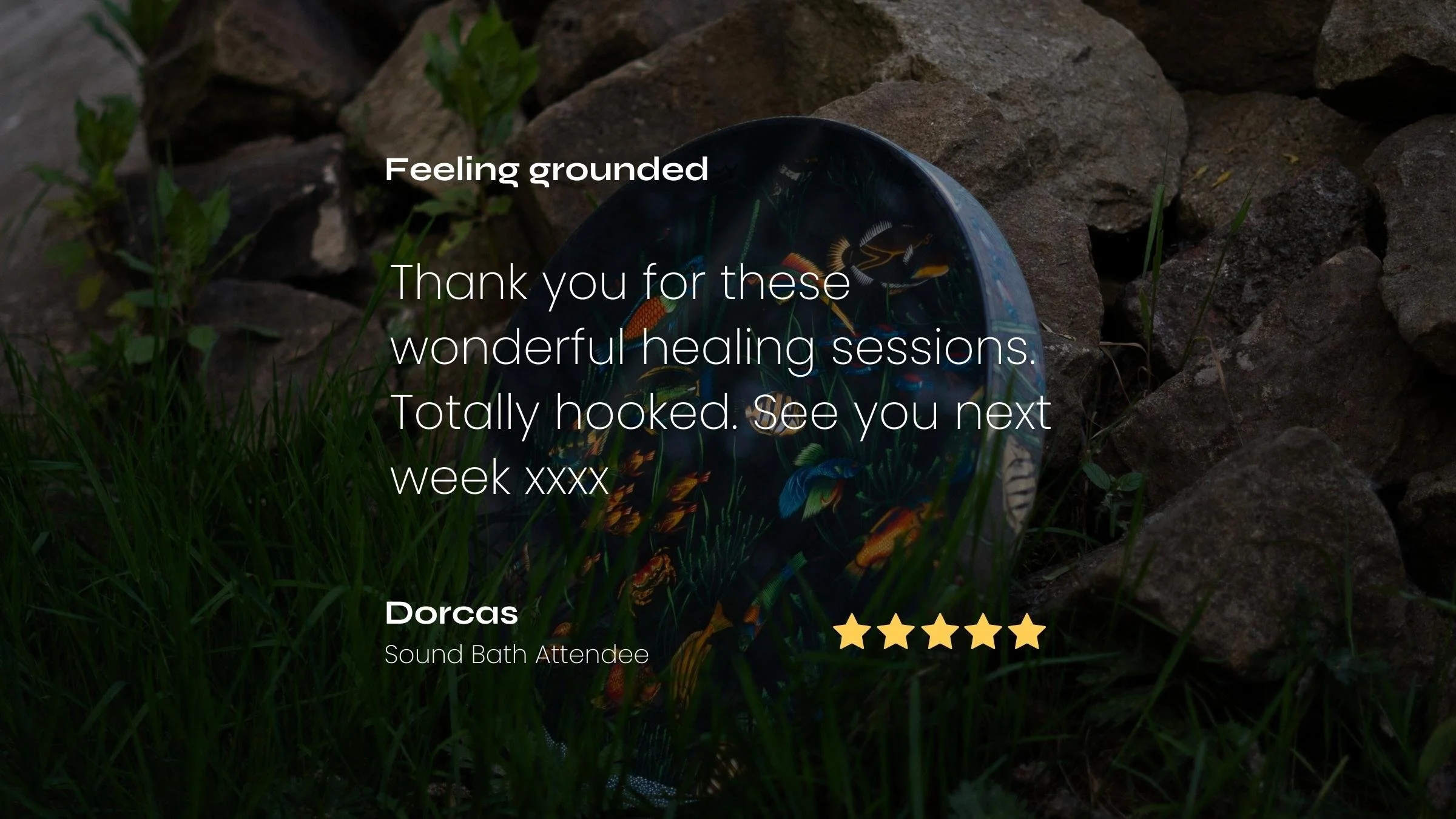 A Remo ocean drum with colorful fish and aquatic plant illustrations, laying among rocks and grass outdoors.  Overlaid text includes a five star review from a Sound Bath Regular, expressing a positive experience. 