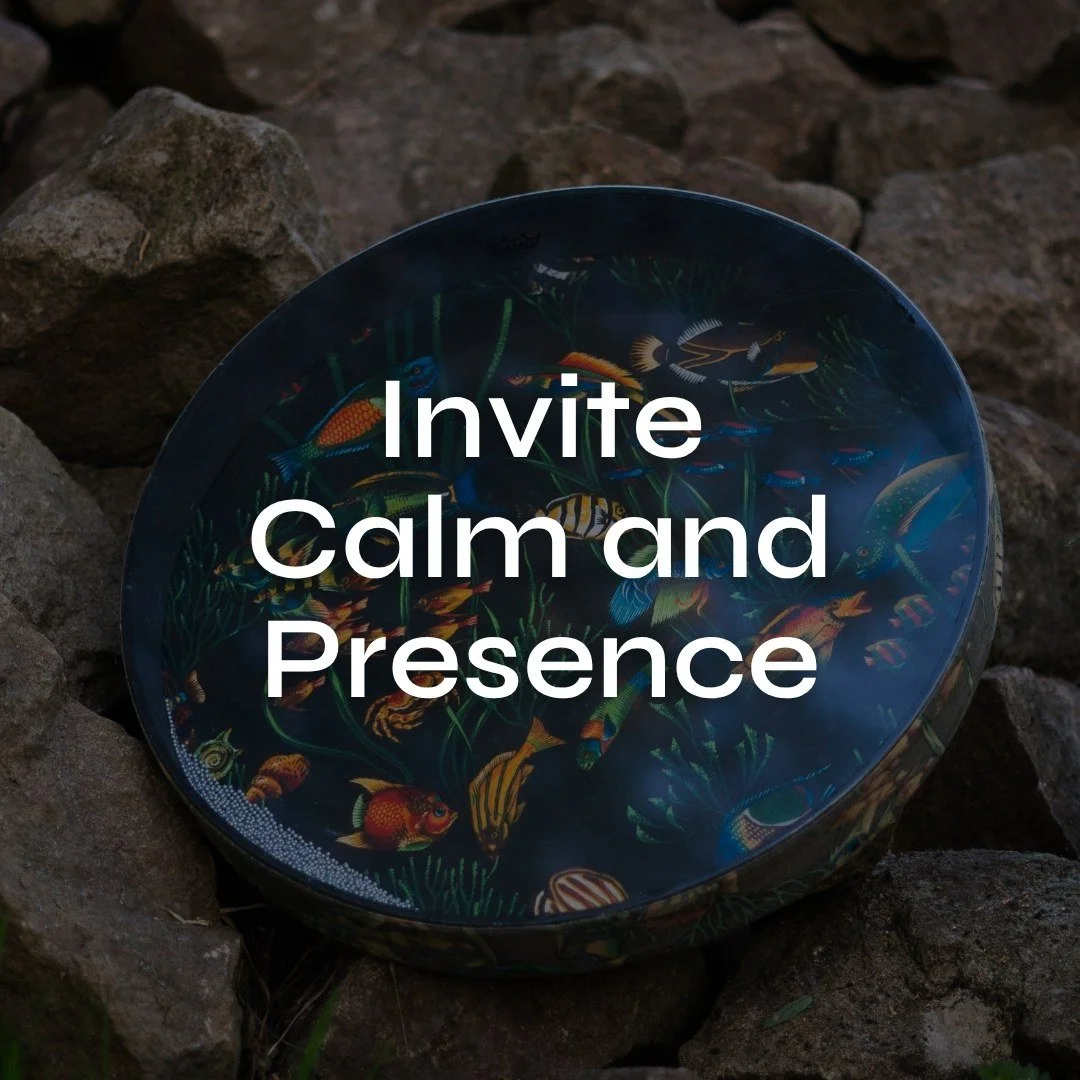 A Ocean drum with colorful fish and aquatic plants pattern laying on a rocky surface, with the text 'Invite Calm and Presence' overlaid.