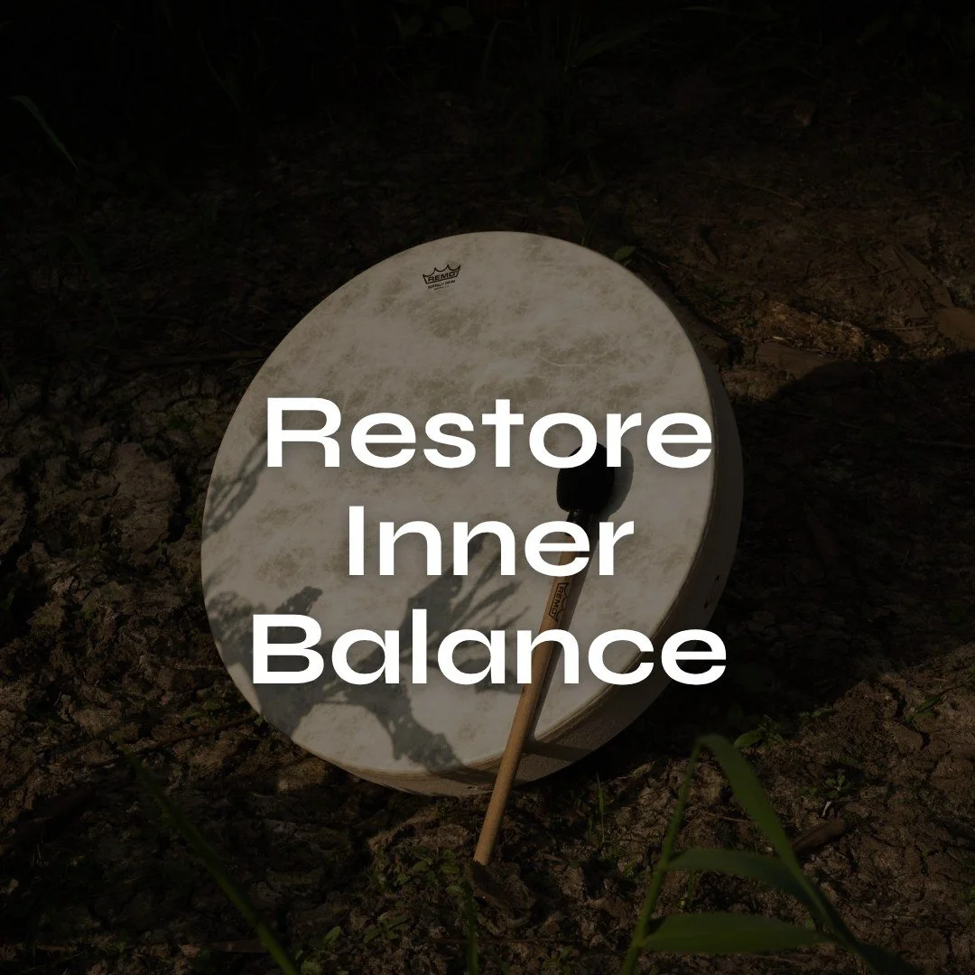 A Remo buffalo drum lying on the ground with a drumstick resting against it, with the text 'Restore Inner Balance' overlaid.