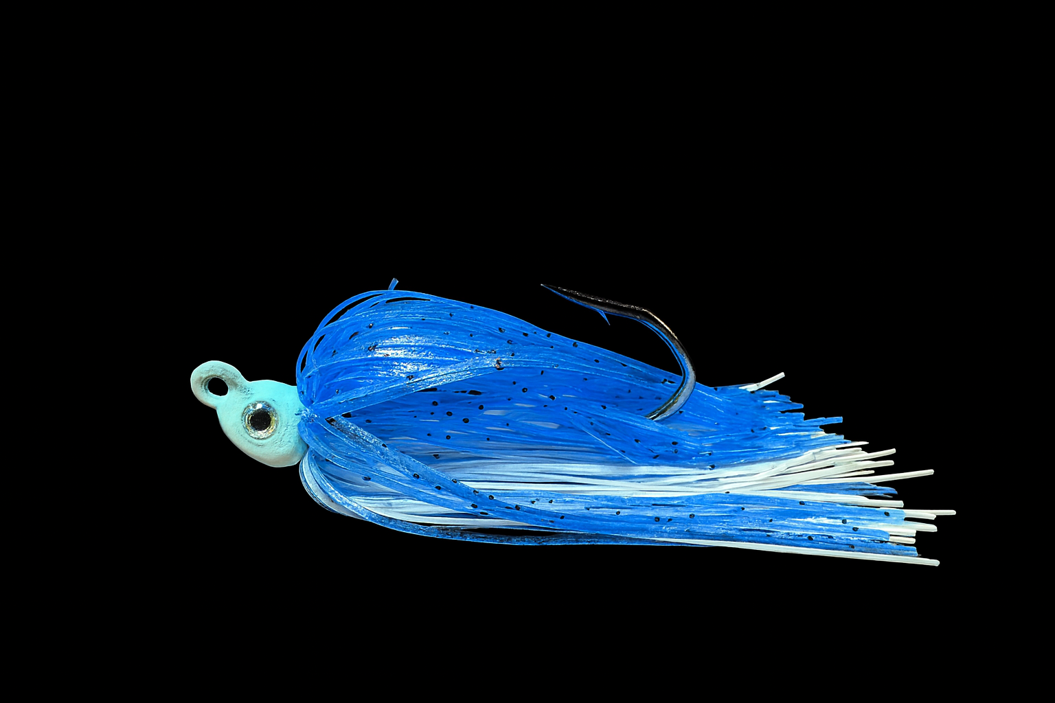 Close-up of a blue and white fishing lure with a black hook, set against a black background.