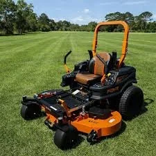 Riding lawn mower in an open land of grass