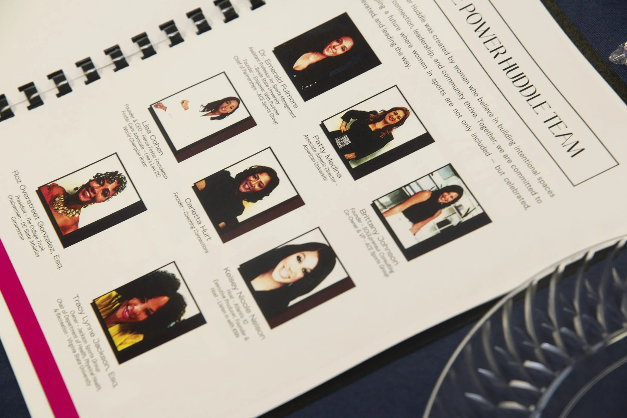 Photograph of a printed informational sheet titled 'Powerful Team' featuring individual portraits, names, and titles of women leaders, including Dr. Epenela Fulmona, Patty Madeza, Lucy Cohen, Carla Hut, Brittany J. Simon, Klapoy Madera, and Tracy Wymore.