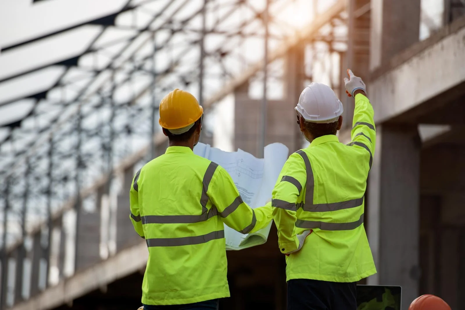 2 engineers inspecting a construction site