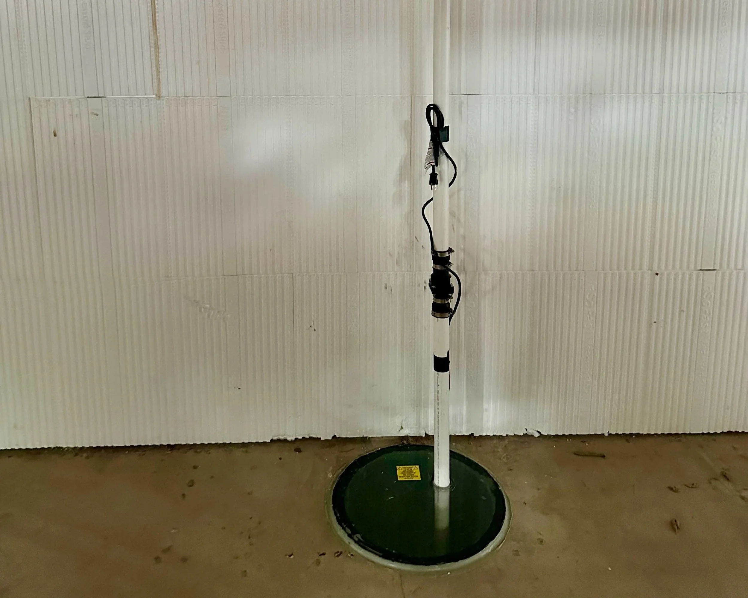 A sump pit with discharge piping
