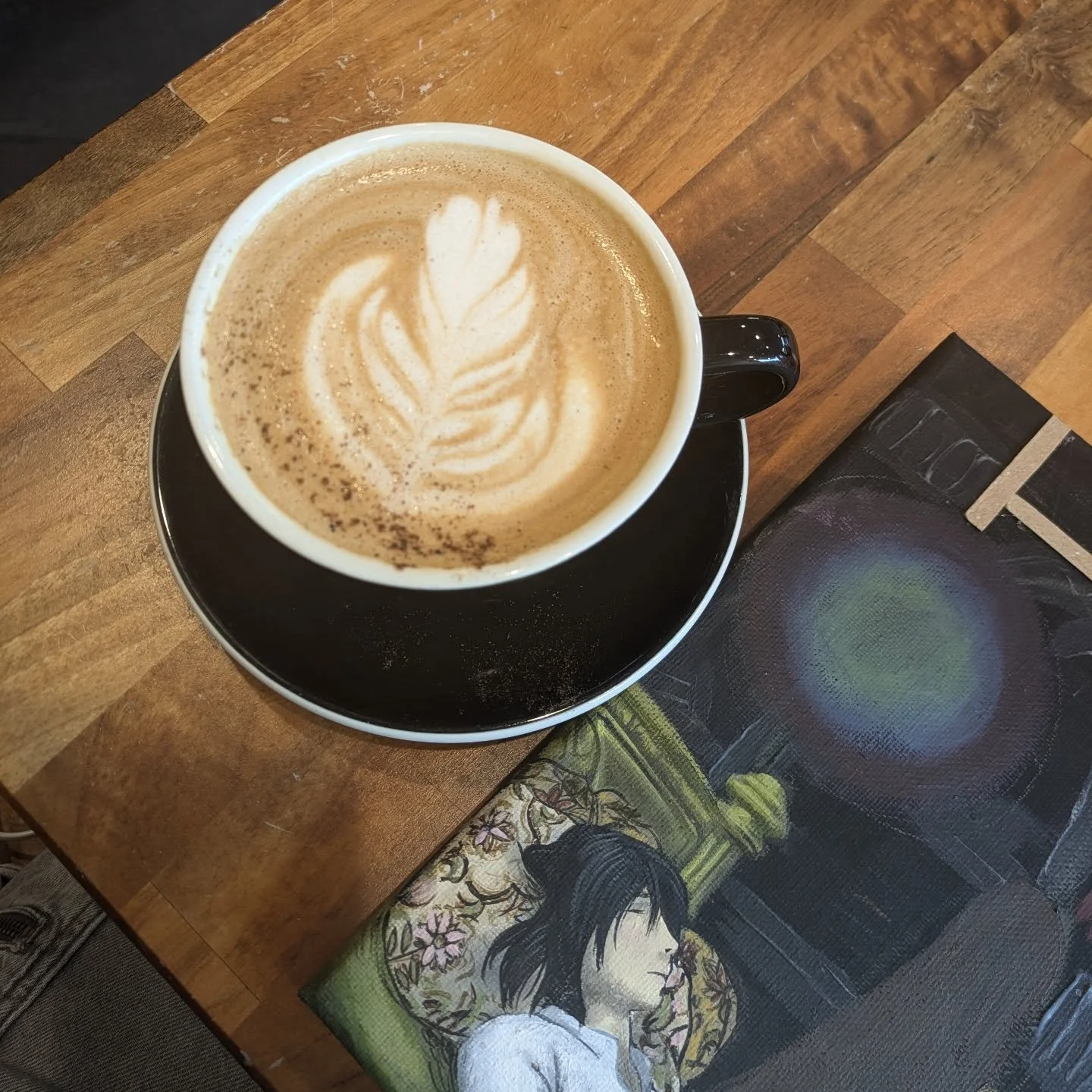 Working at the coffee shop today &lt;3 except this time, my art is hung on the walls! 

Come by @elementarycoffeeco and check it out! 

.
.
.
#ghiblifanart #howlpendragon #latteart
