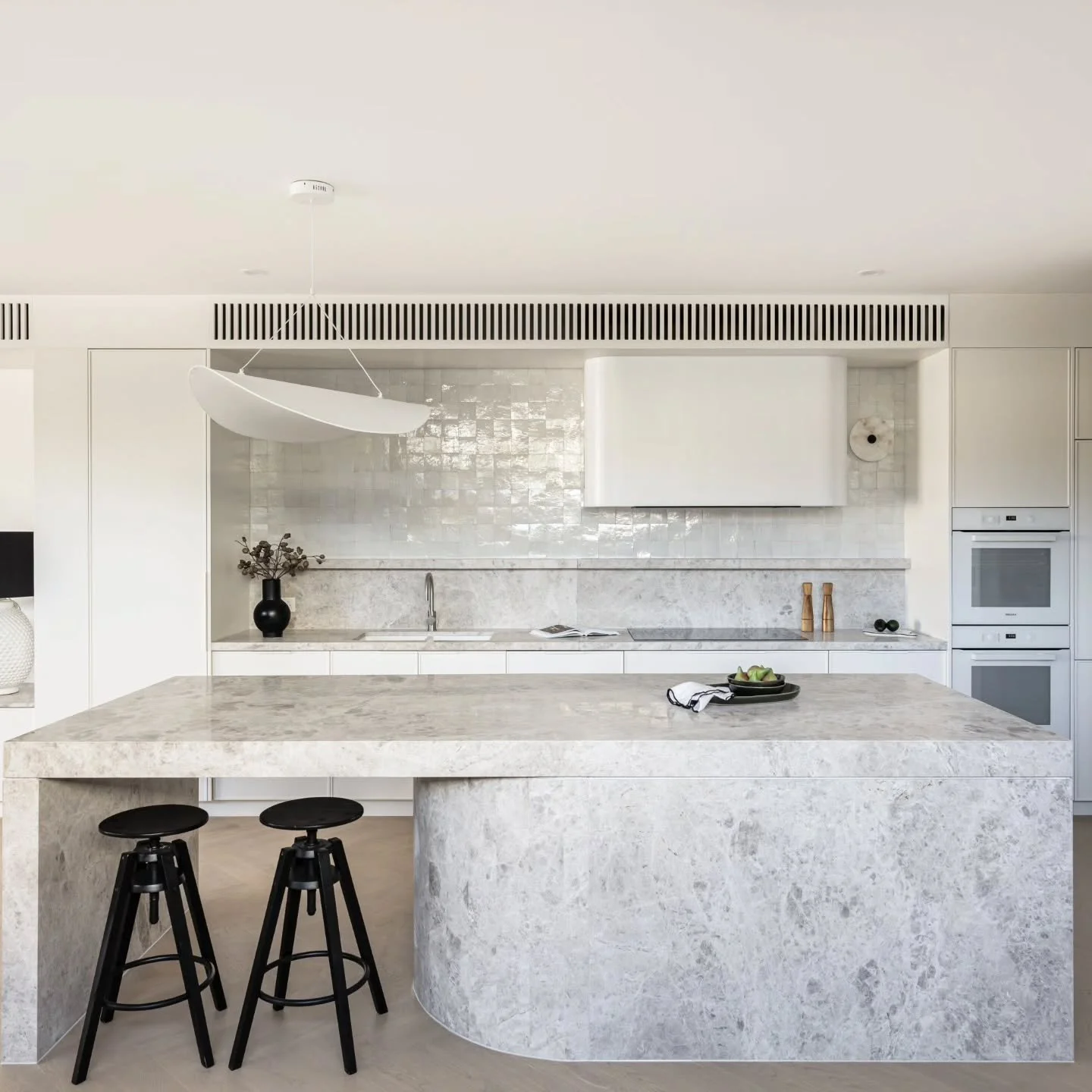 Our statement Turco Argento curved island is the hero of this kitchen, with the zelliege tiles and silk pendant softening the space and creating a centrepiece that's meant to be gathered around.

Launching now with @mcneicex