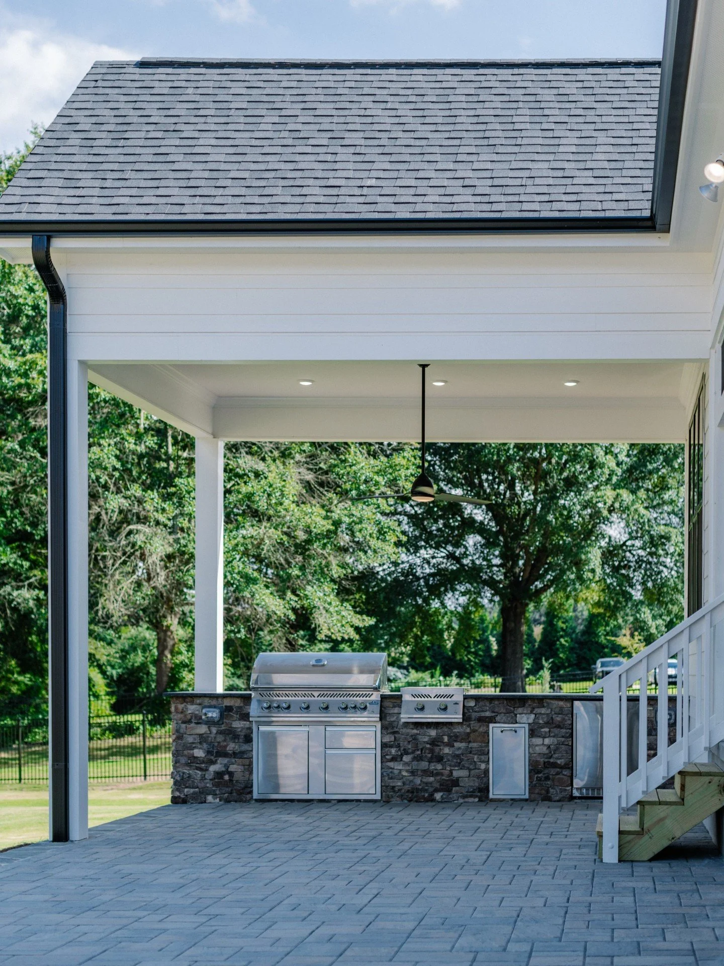 Grillin' season is officially here! Is your backyard ready? 🍗

This is one of our favorite outdoor setups, and it's easy to see why. A Napoleon Grill and Griddle for cooking, a built-in fridge for drinks, stone prep space, and a covered patio fan to