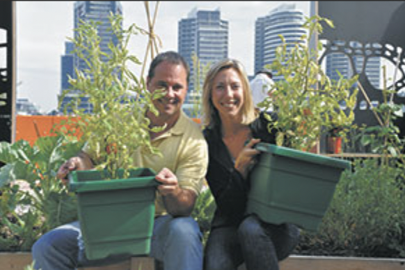 Emily and Paul Mercurio on Mercurio's Menu show in the Docklands garden. Sharing a vision of urban agriculture and also having a fencing bout in the garden. Emily's dad Bob knew Paul's dad Gus, who was a professional boxer. Gus gave Emily tips in fen