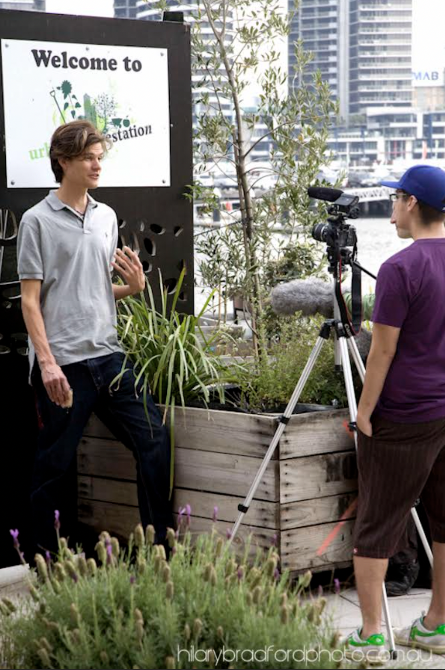 Baden Holt, Urban Reforestation volunteer being filmed for a film on Urban Agriculture. Photography by Hilary Bradford.