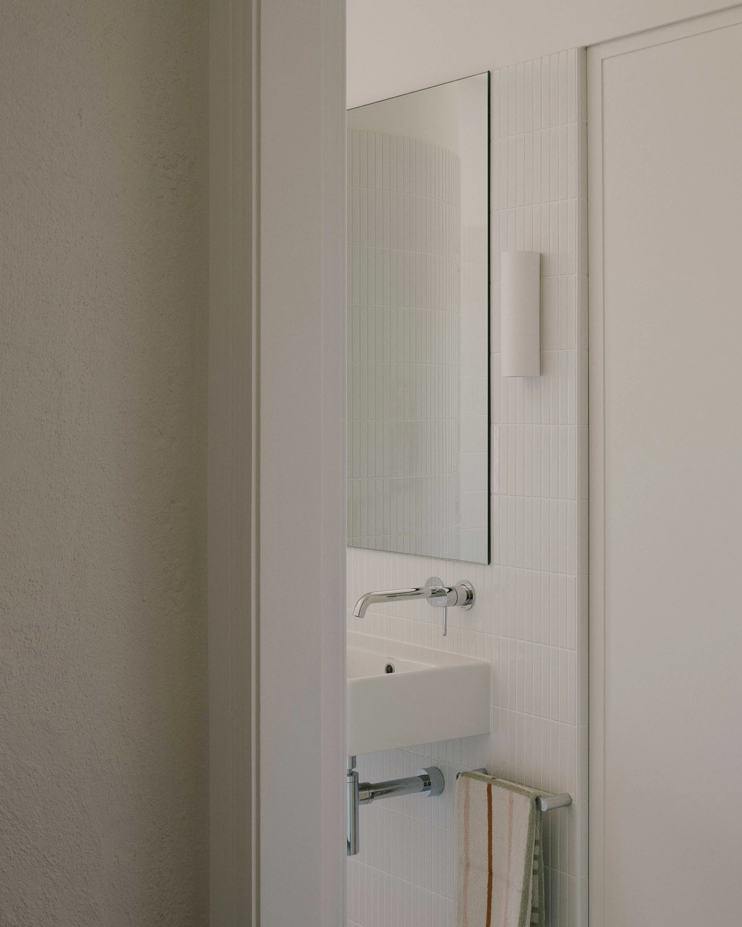 Hallway view bathroom Berrima renovation - integrated laundry joinery ZF Architects