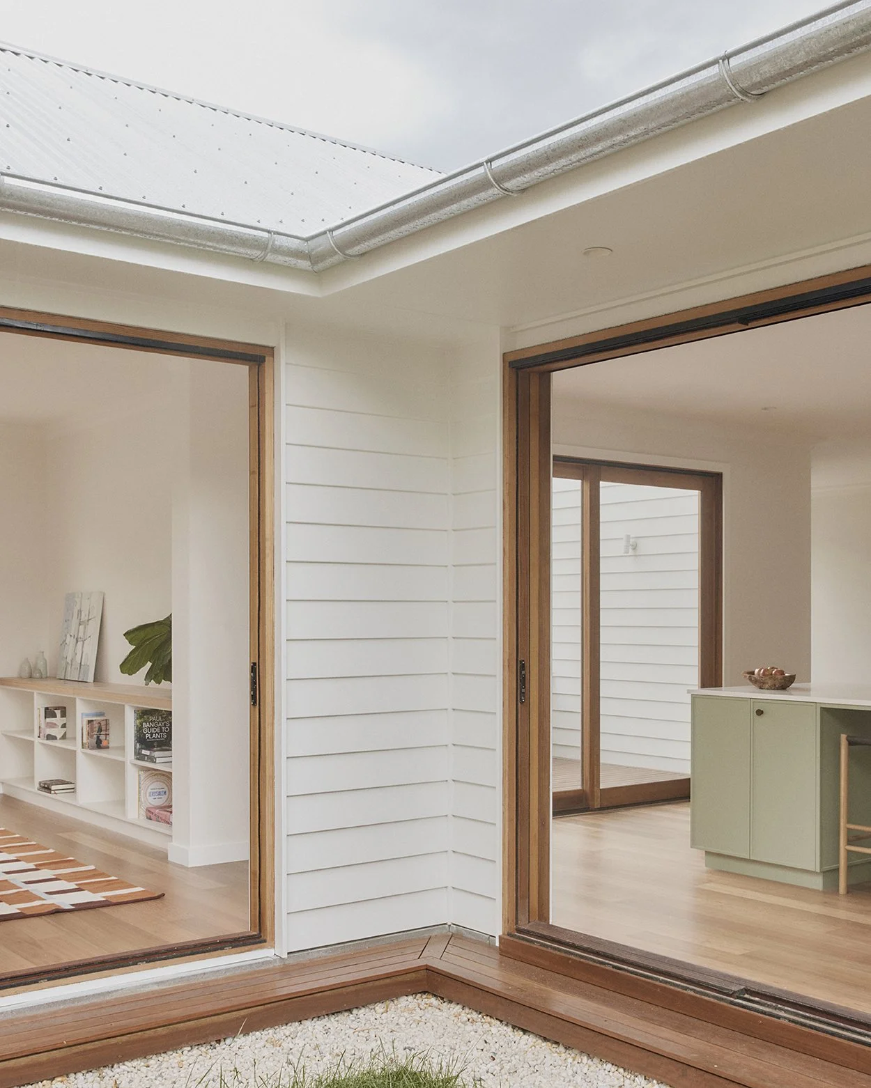 Sun-deck with oversized skylight connecting living room and kitchen to the private courtyard, Mittagong Courtyard Cottage