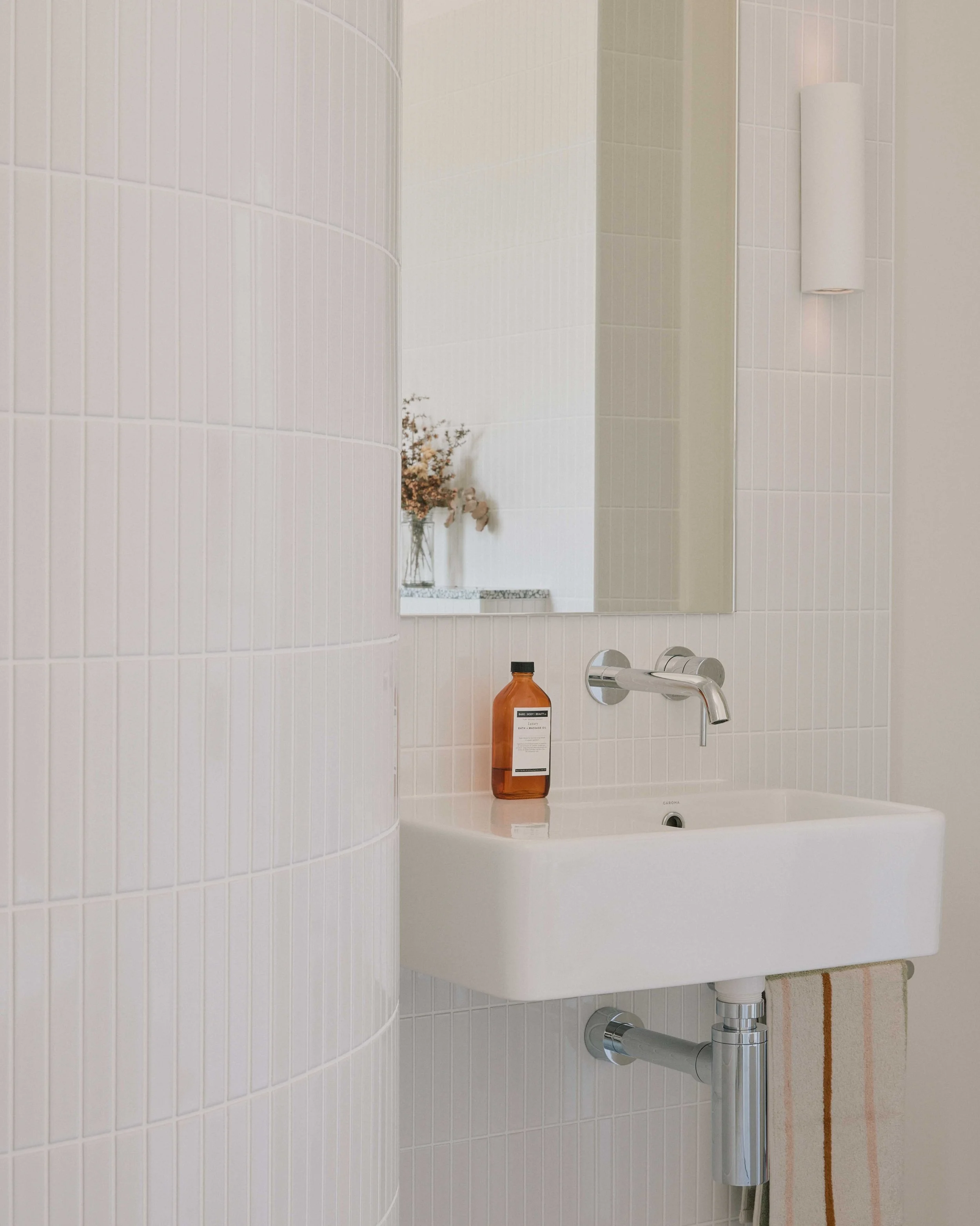 Curved tile wall Berrima bathroom - custom basin mirror lighting ZF Architects renovation
