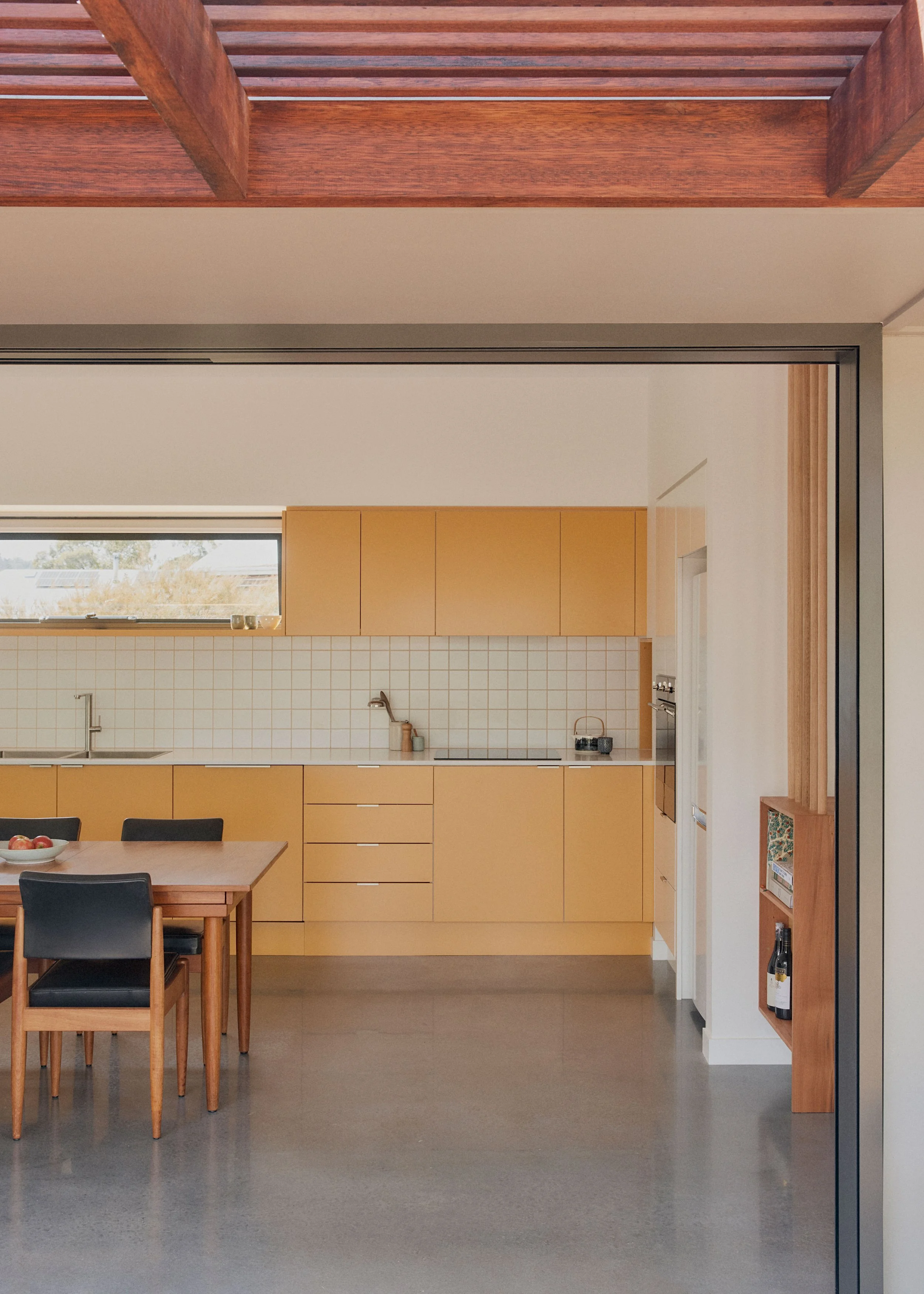 Bright yellow kitchen Berrima Garden House - compact secondary dwelling design ZF Architects