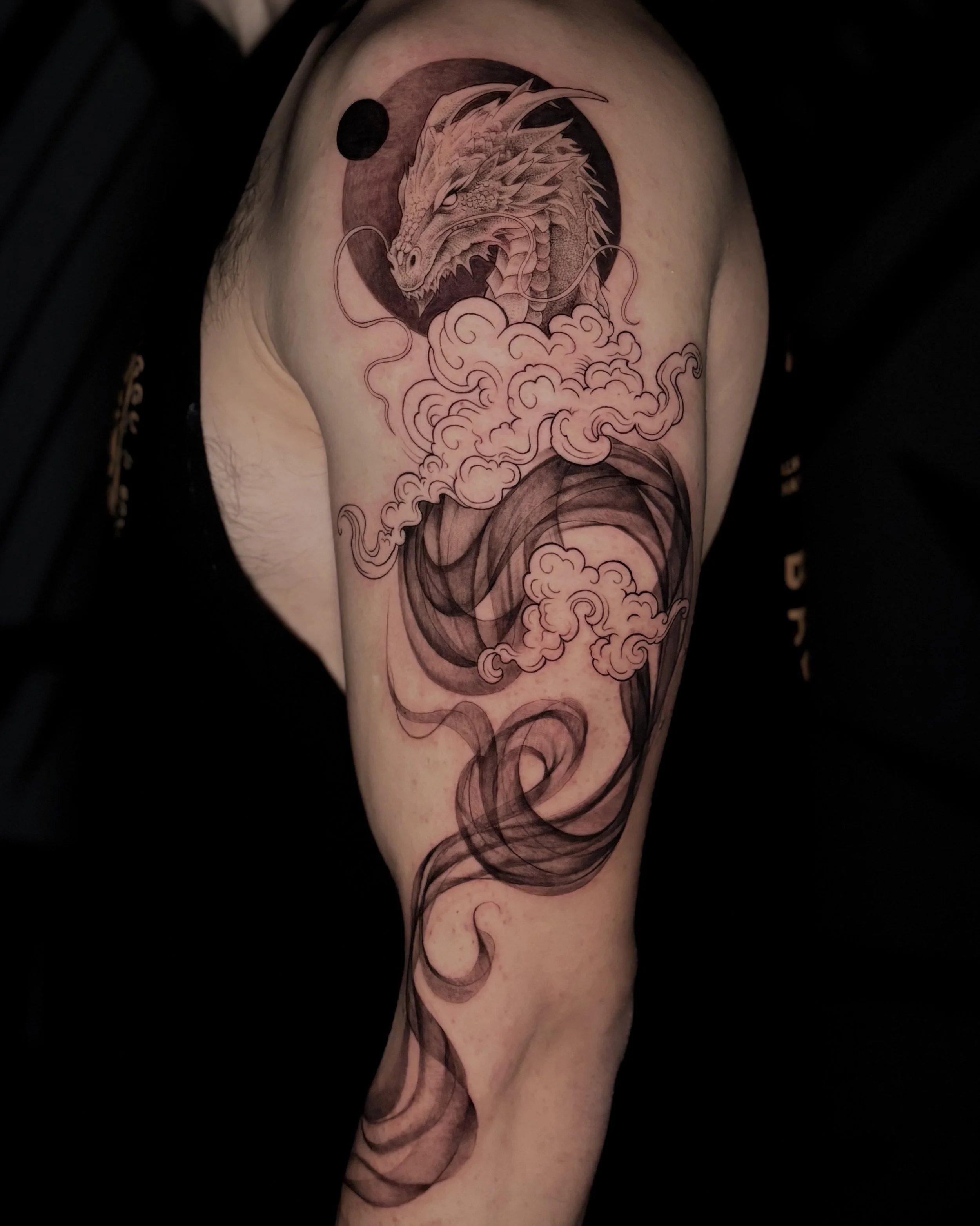 Soft and flowy black and grey tattoo by Soleya Tattoo in Auckland —merging fine detail with flow through smoke  