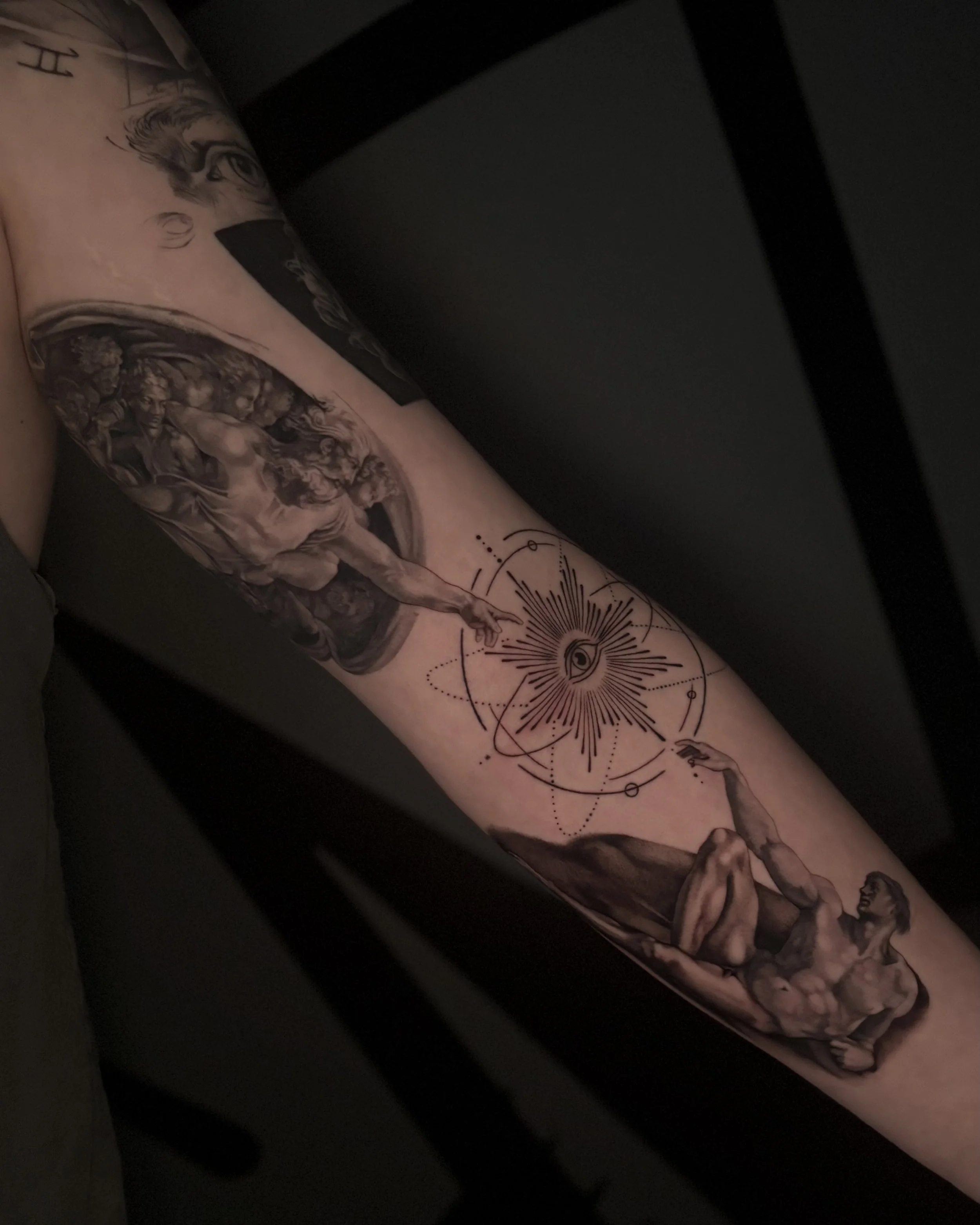 Super detailed black and grey realism tattoo by Soleya Tattoo in Auckland —carefully crafted version of ‘the creation of Adam’ 
