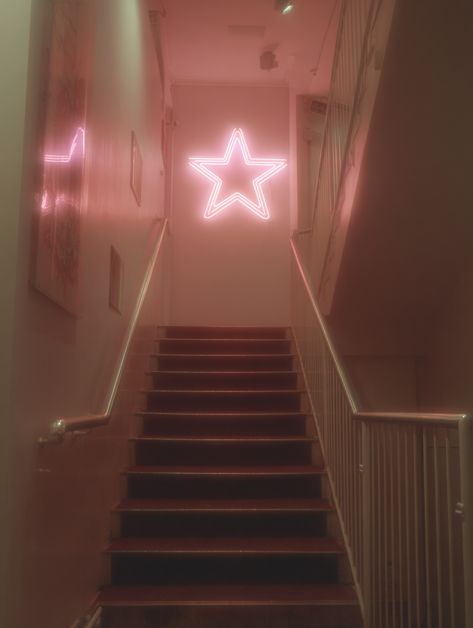 a mystical staircase with a neon star