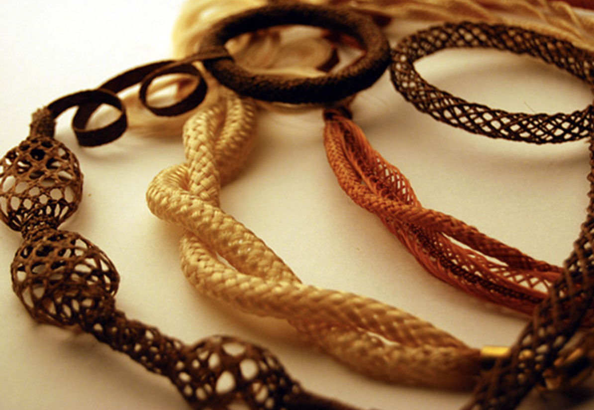 Multiple strands of different colour hair, intricately woven, mourning jewellery.