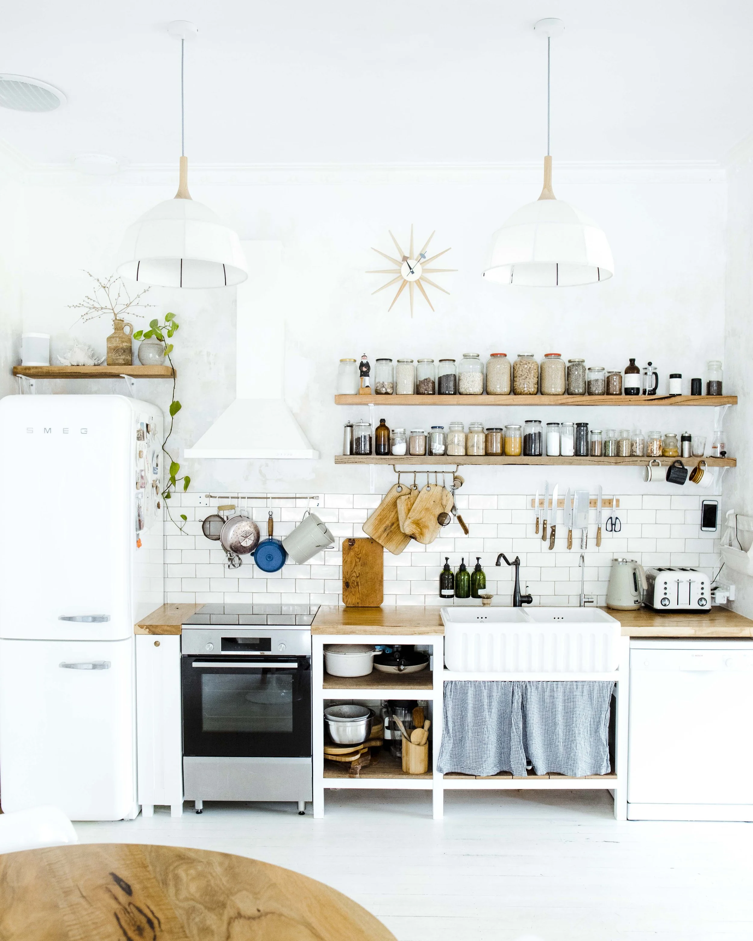  Warm timber softens the architecture and adds a lived in, tactile quality. It is a reminder that countertops are more than surfaces. They influence the whole mood of a kitchen. 