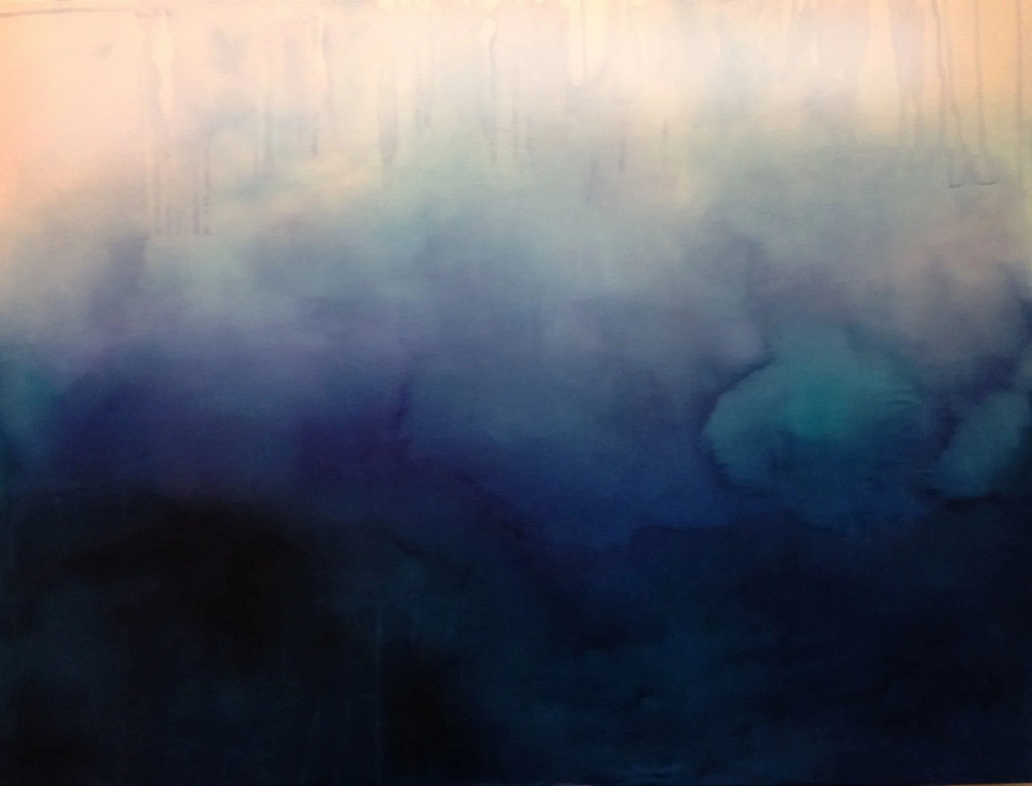 A blurry photo of a landscape with trees, possibly a forest, and a body of water, with soft pastel colors and a dreamy, misty appearance.
