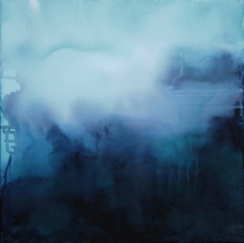 Abstract watercolor painting in shades of blue, with misty and cloud-like formations.