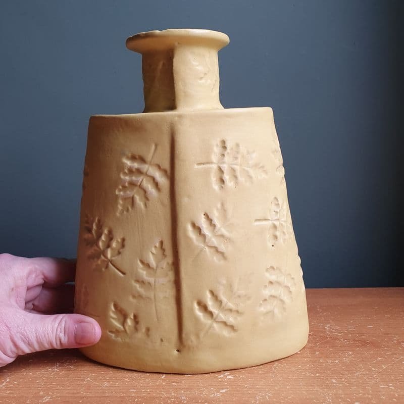 yellow pottery flask.jpeg