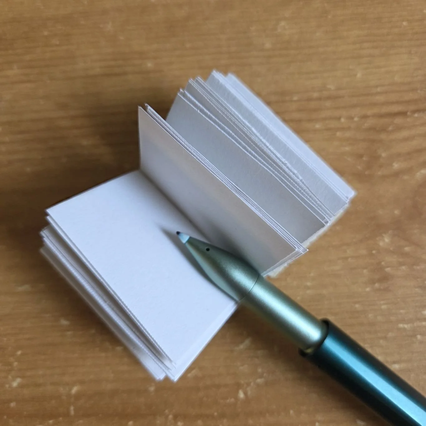 Tiny sketch book and pen