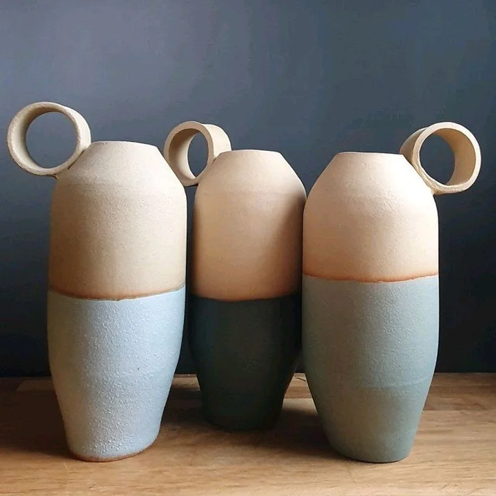 These slab-built decorative bottles bring a handmade charm to any space 🌿. I had so much fun crafting these - each has its own unique character! Which one would you pick to display in your home? #handmadepottery #rusticdecor #ceramicart