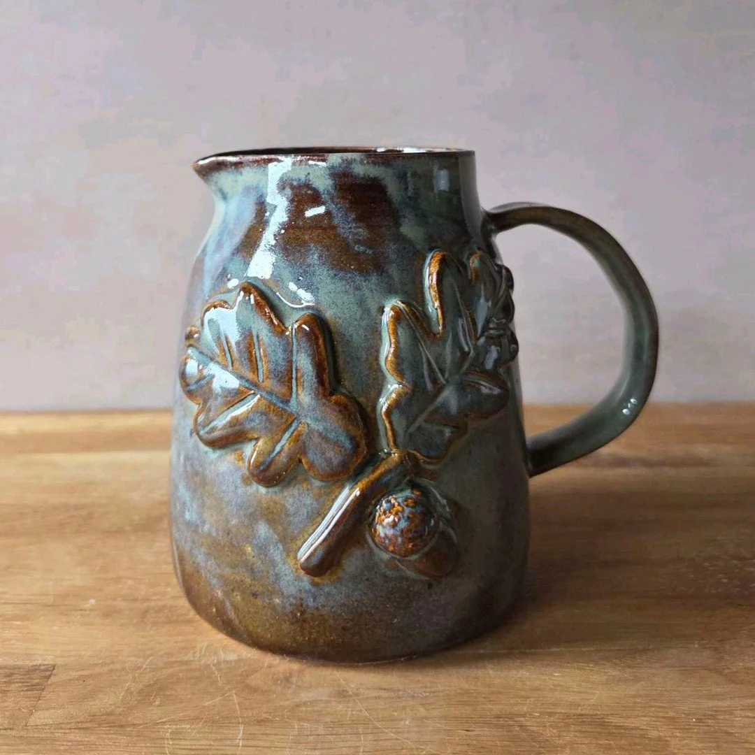 Two out of four made it through - these jugs endured the process! 😌 Hiccups are part of the journey, and I&rsquo;m thrilled to share this rustic oak leaf design with you all. What do you think? 🍂✨

#ceramicart #potterylife #handmadeprocess