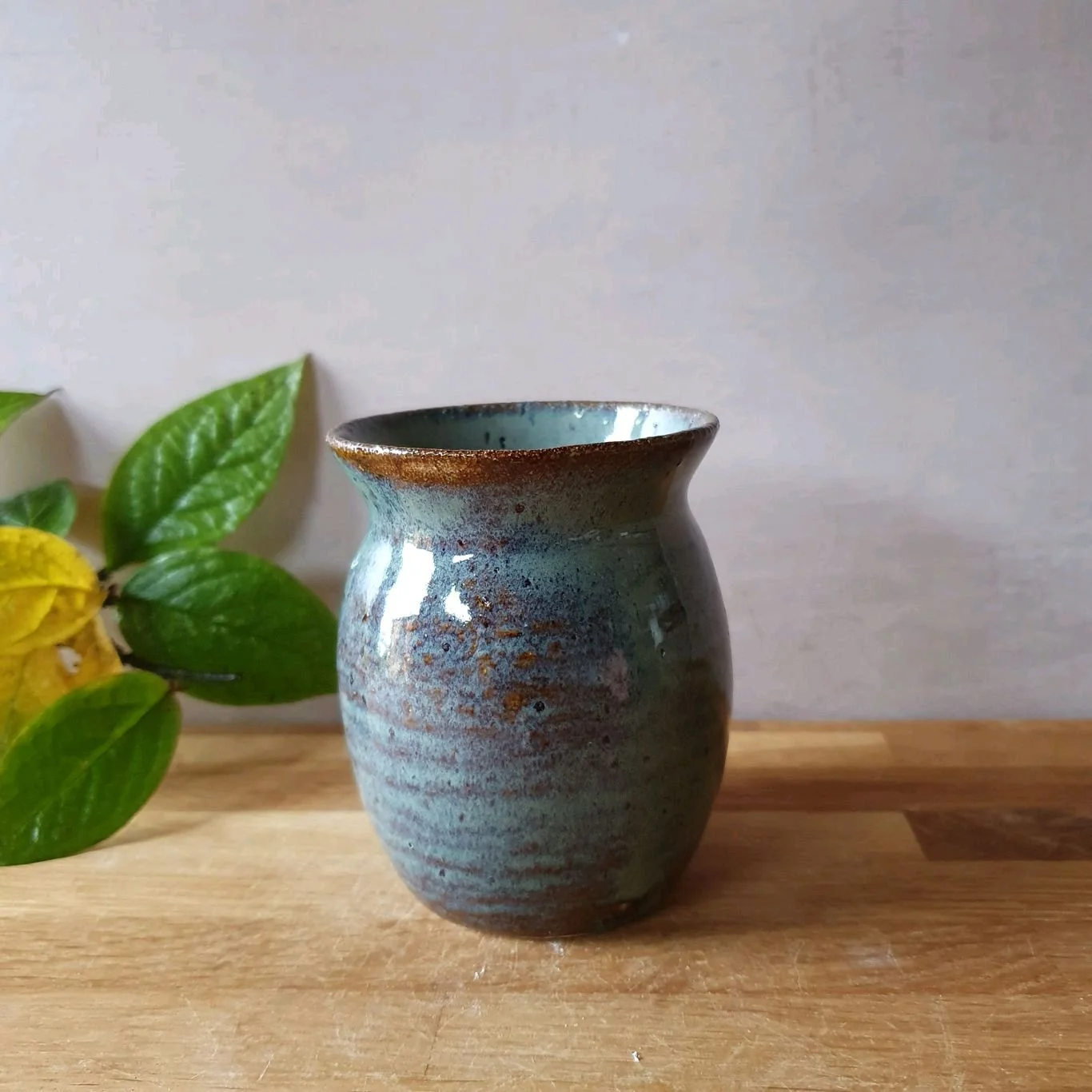A splash of earthy blues and browns, this ceramic vase encapsulates the tranquility of nature - simple, serene, and timeless. 🌿 Handmade with love, it's the perfect addition to any cozy corner. Where would you display this little piece of calm? 🥰

