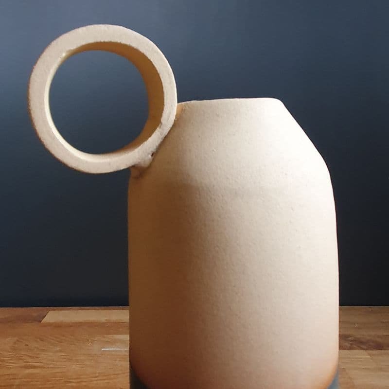 Side ring on pottery bottle