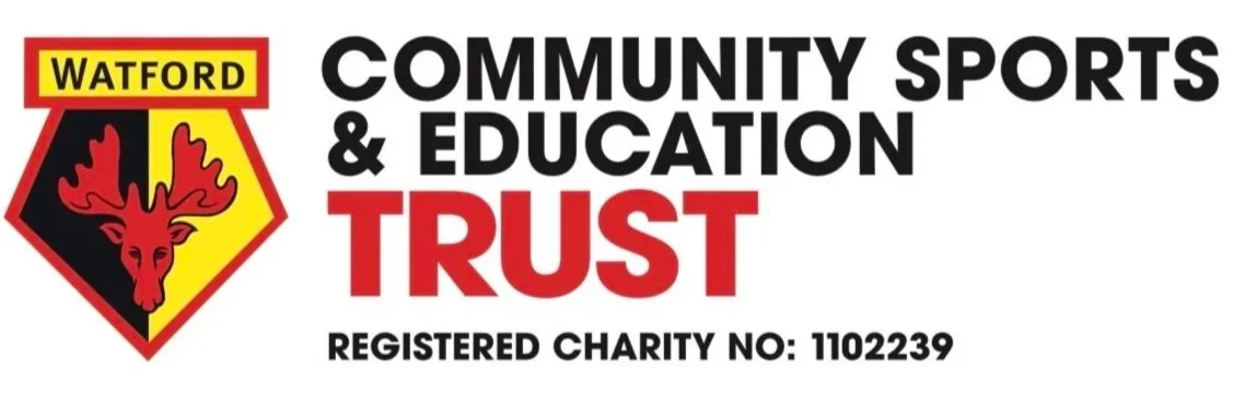 Logo for Watford Community Sports & Education Trust, featuring a crest with a red stag and yellow and black background, along with text promoting the charity with its registered charity number.