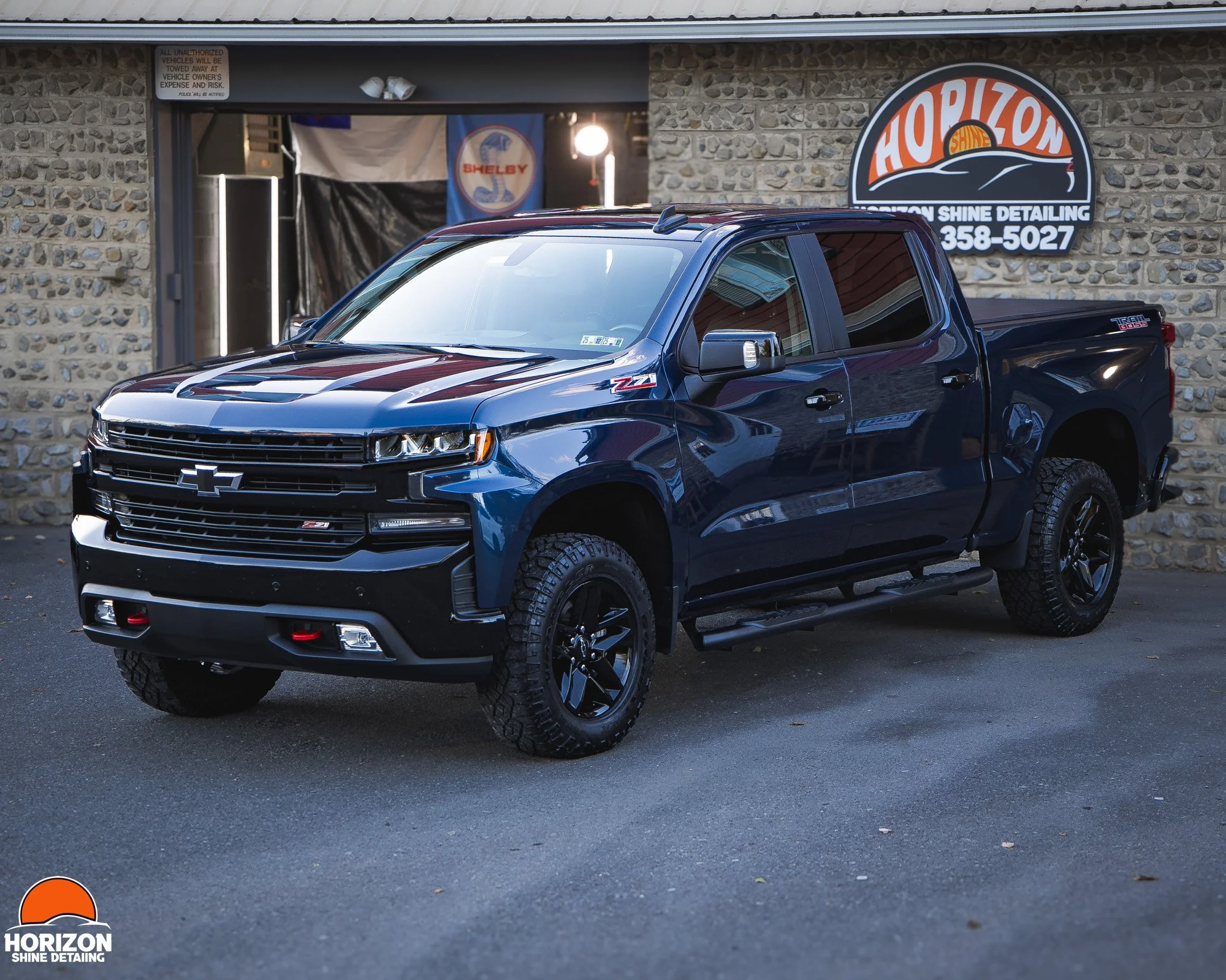 Dark Blue Chevy Silverado Parked outside of Horizon Shine Detailing