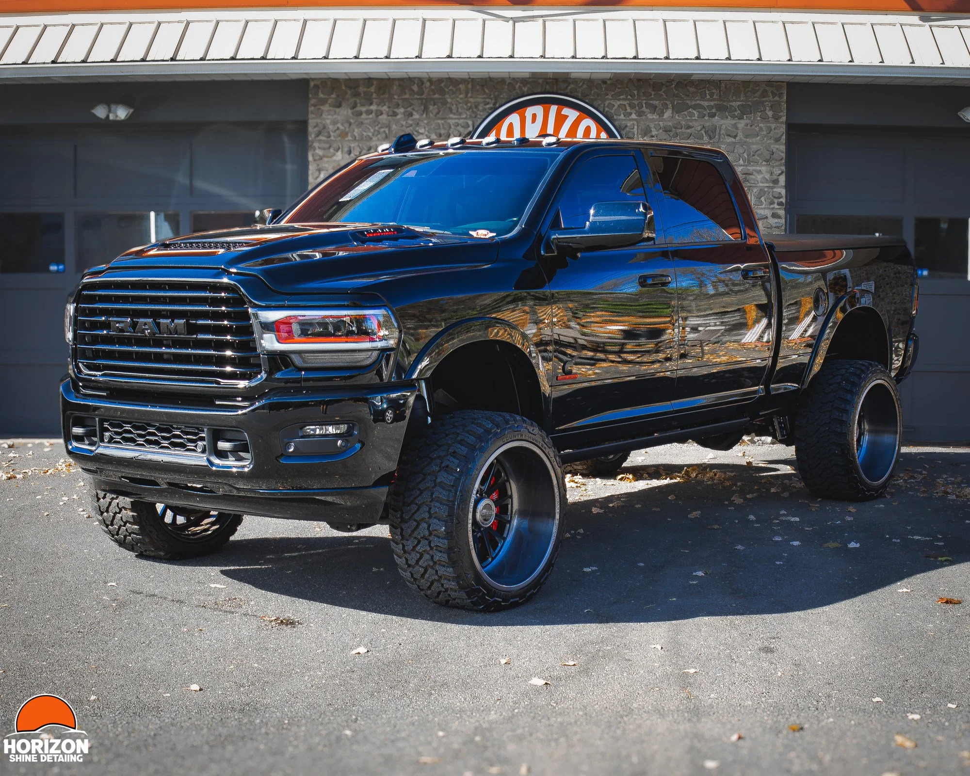 Black Lifted Ram Truck With Custom Wheels